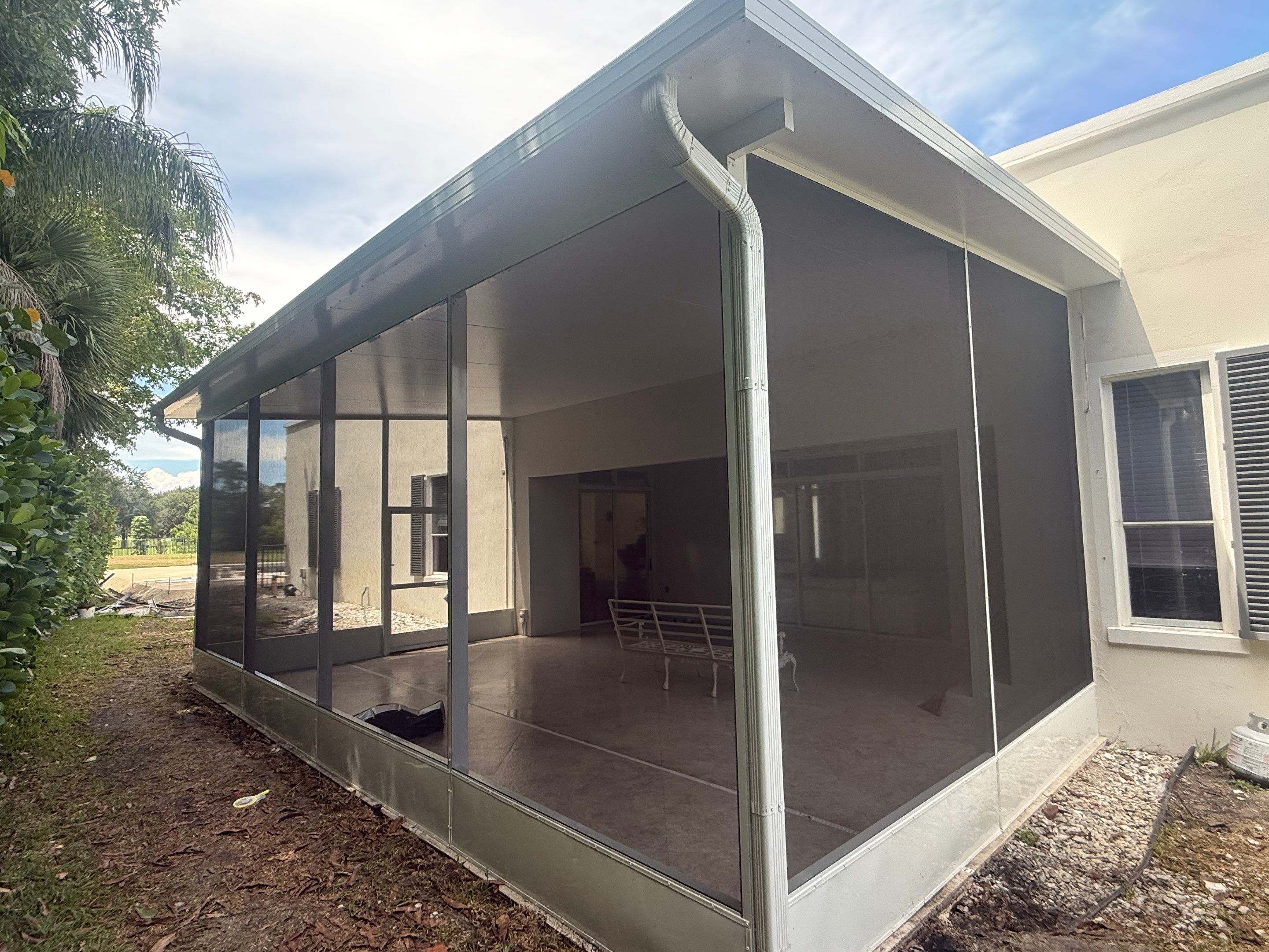 Aluminum Insulated Roof and Screen Enclosure Installation in Atlantis by The Screen Depot, Inc