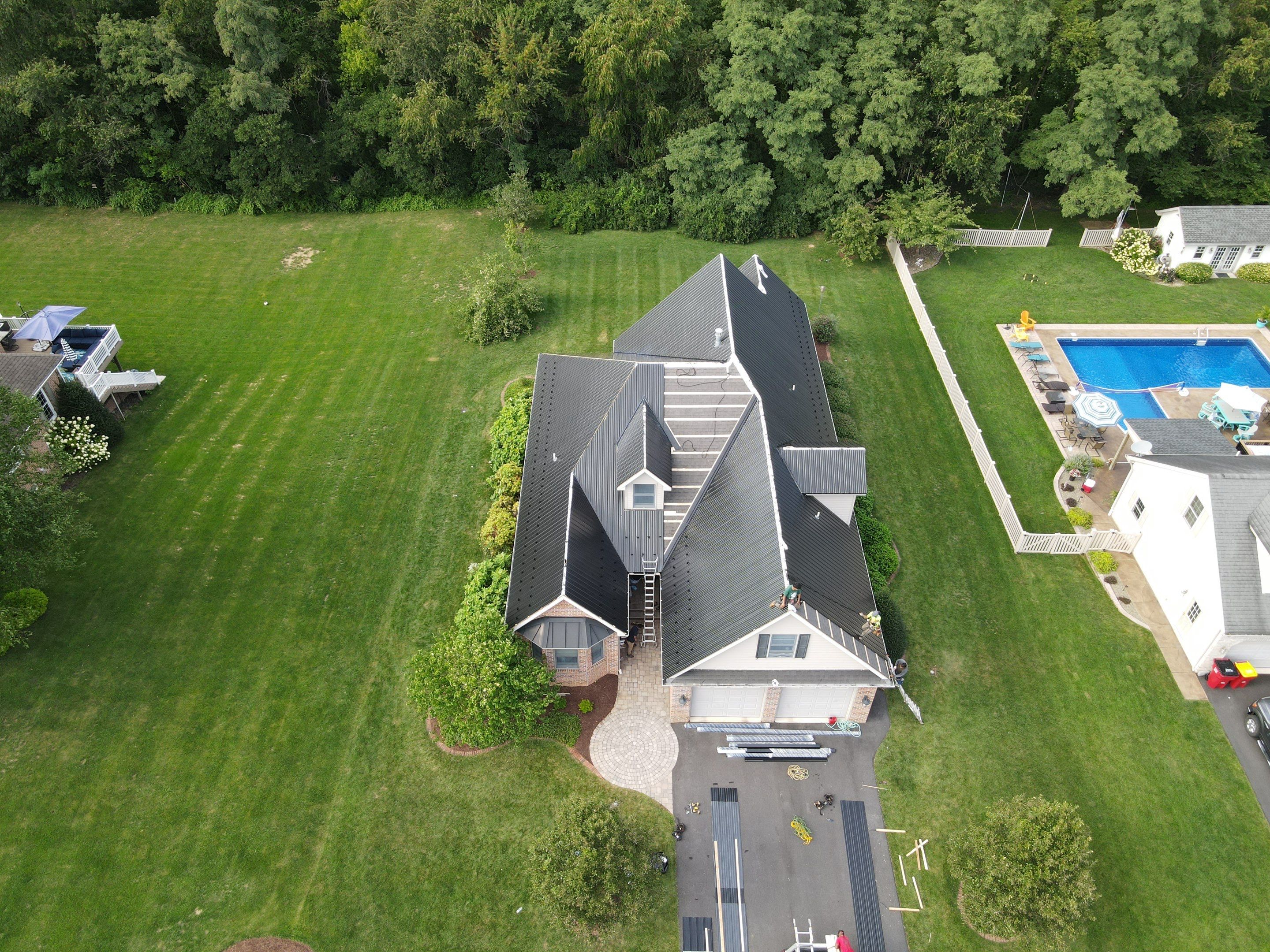 Standing seam / Azm panel in black  by Teflon Roofing