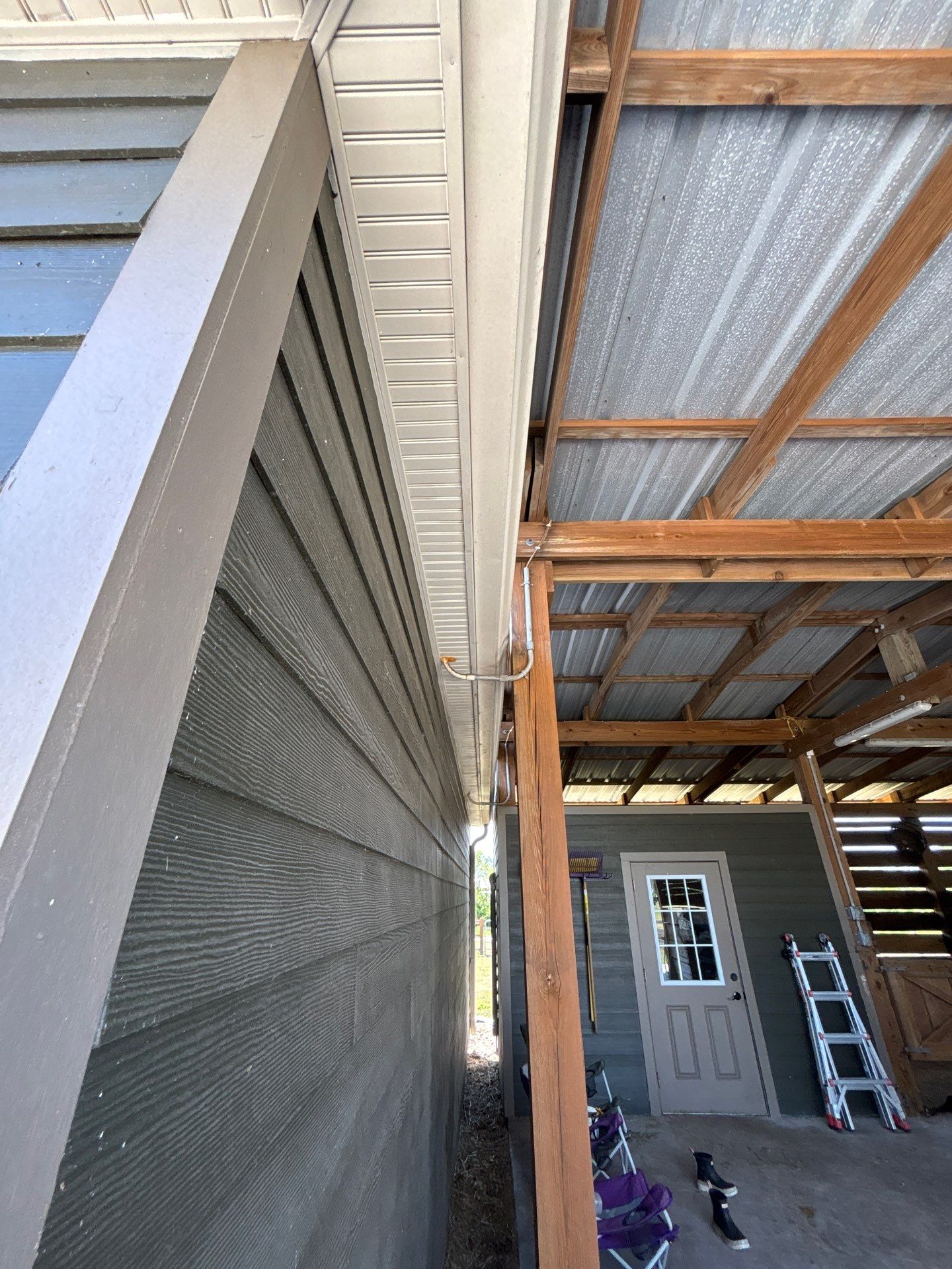  7-inch White seamless gutters and downspouts in Myakka City FL by Gutter Professors