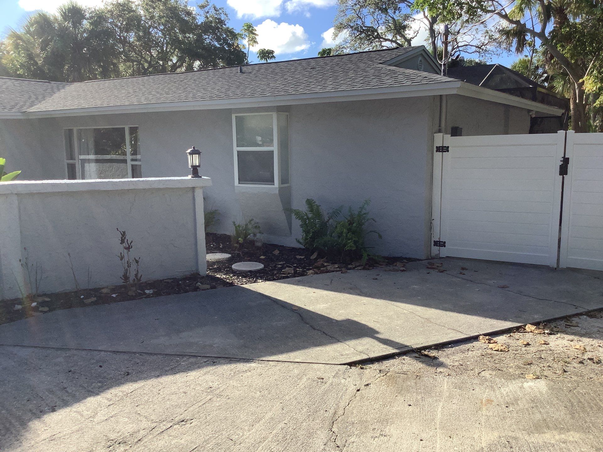 Black Seamless Gutters Installation in Siesta Key FL by Gutter Professors