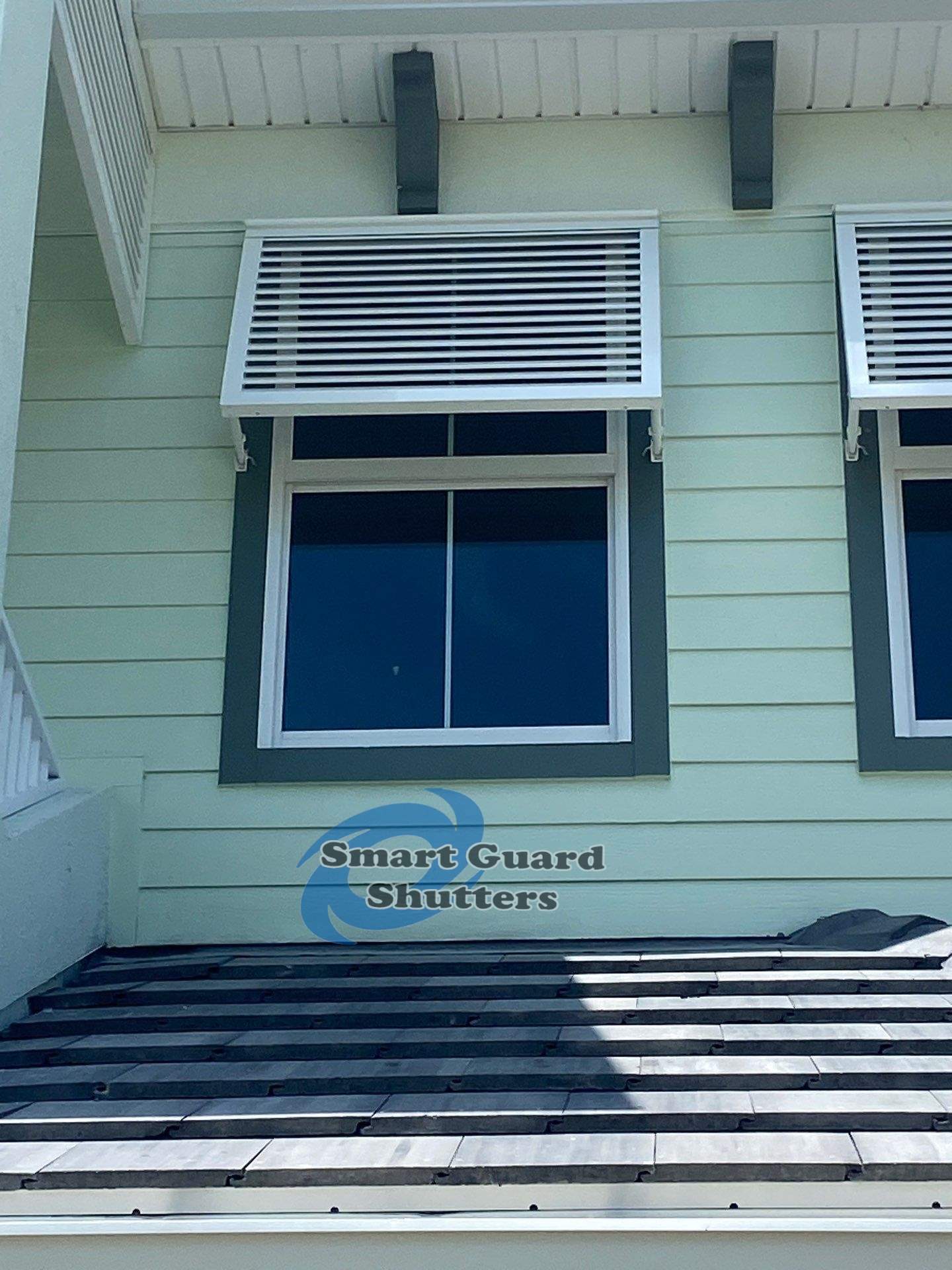 Decorative Bahama Shutters in Traffic White by Smart Guard Shutters