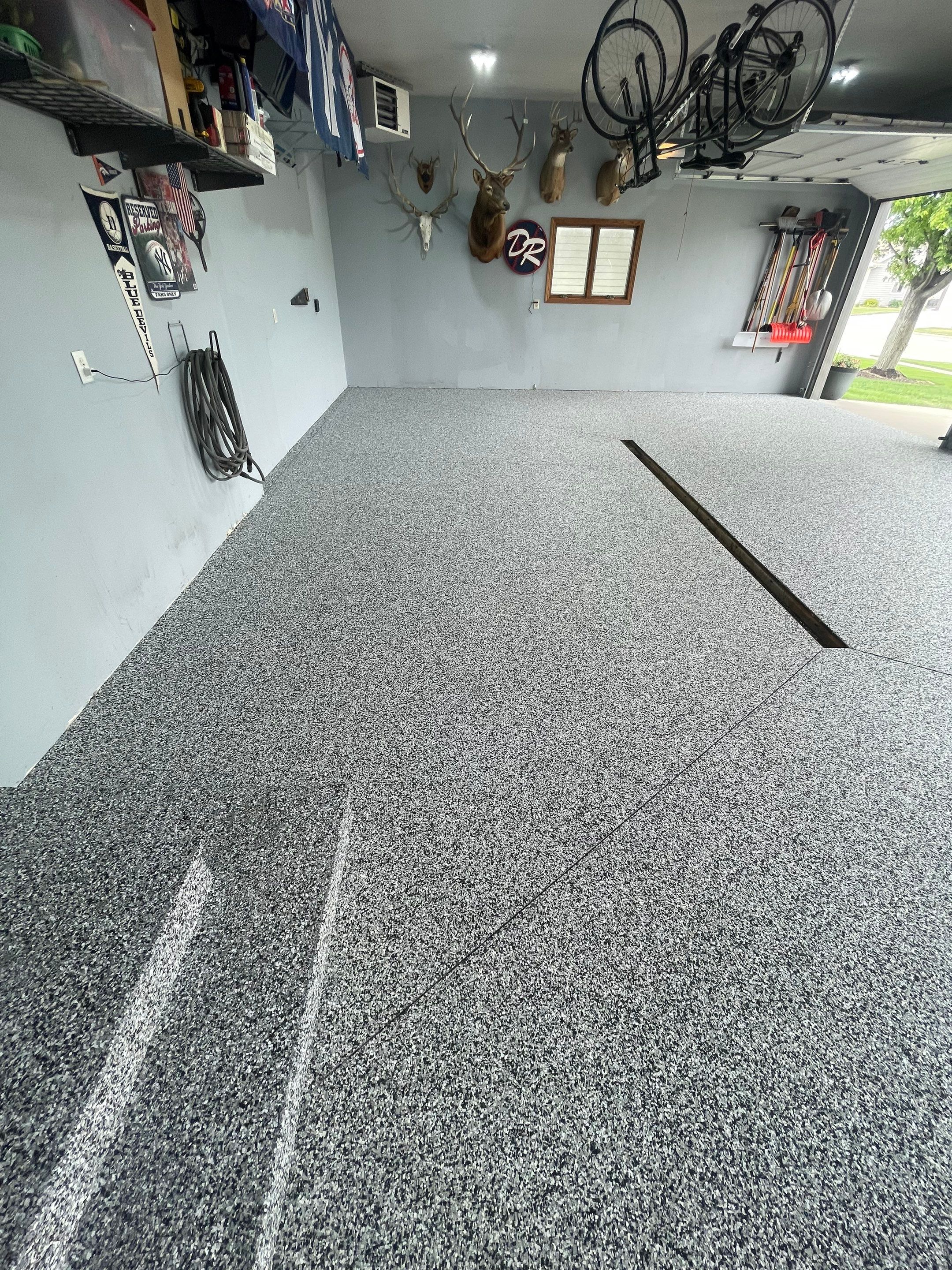 Full Garage Floor Epoxy Coating Installation in Dell Rapids by Select Painting, Coatings & Garage Cabinets