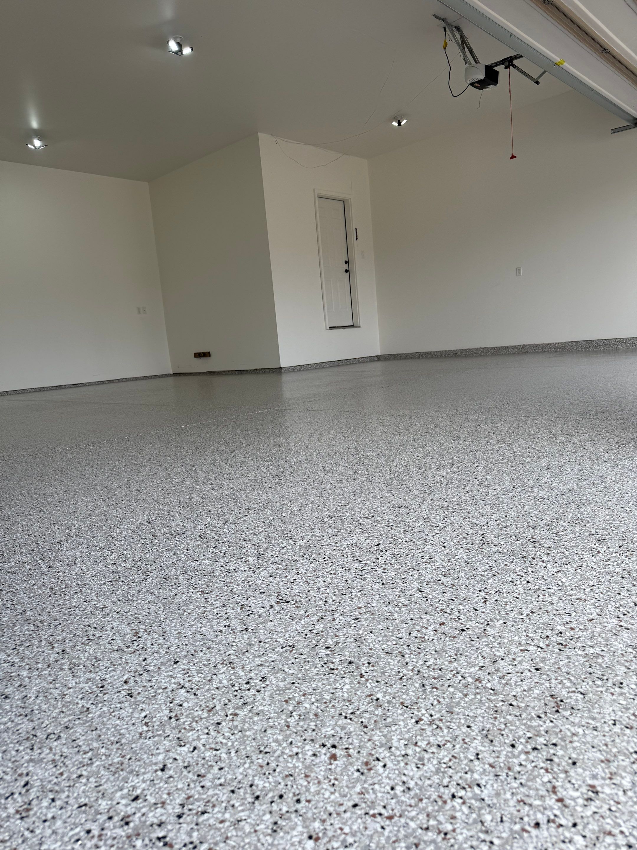 Full Garage Floor Resurfacing and Decorative Epoxy Flake Finish by Select Painting, Coatings & Garage Cabinets