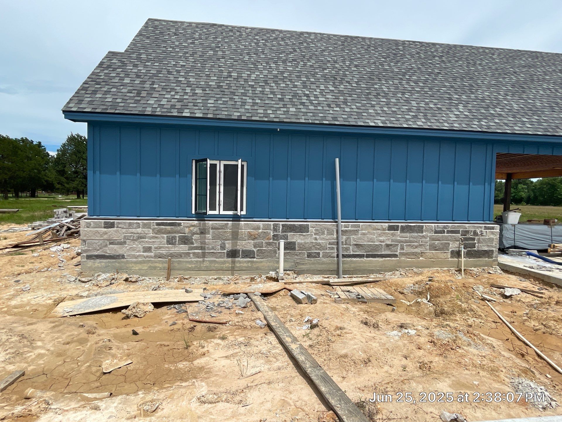 Natural Stone Elegance: Apex Installation Accented by Blue Siding by Apex Conventional Stucco Llc