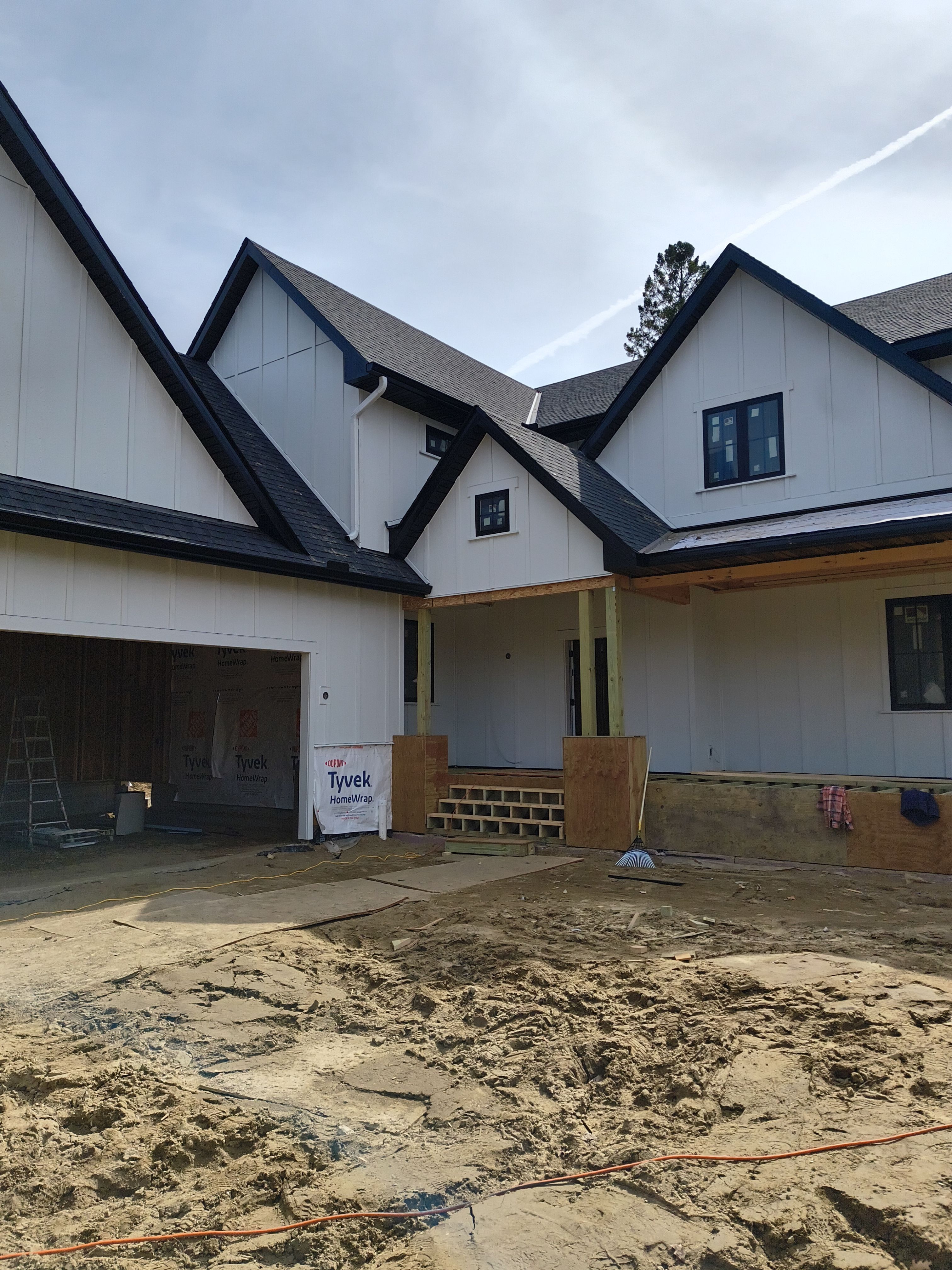 Black Seamless Gutter Installation for New Excelsior Home Build