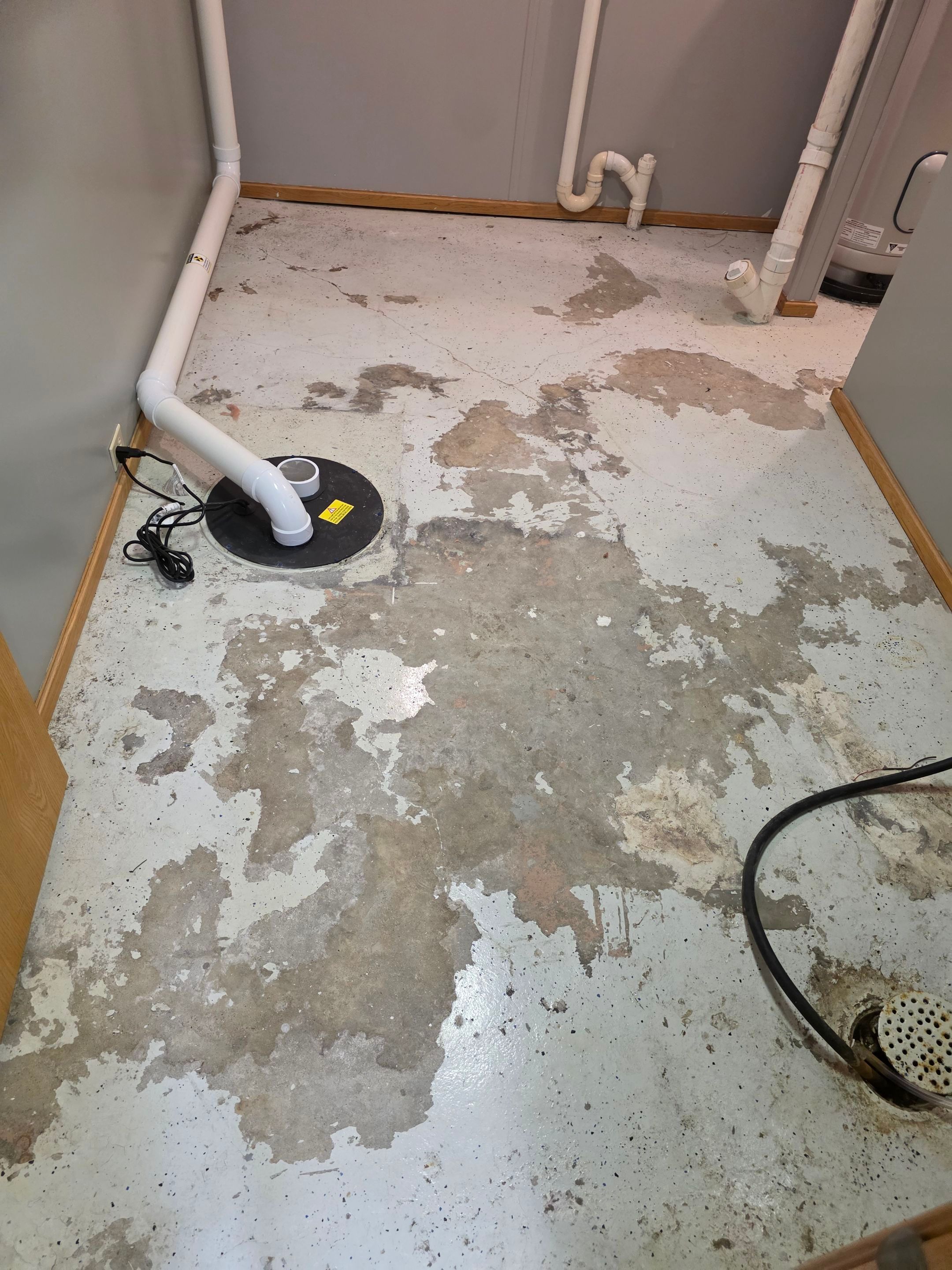 Full Garage and Basement Epoxy Floor Coating in Winner by Select Painting, Coatings & Garage Cabinets