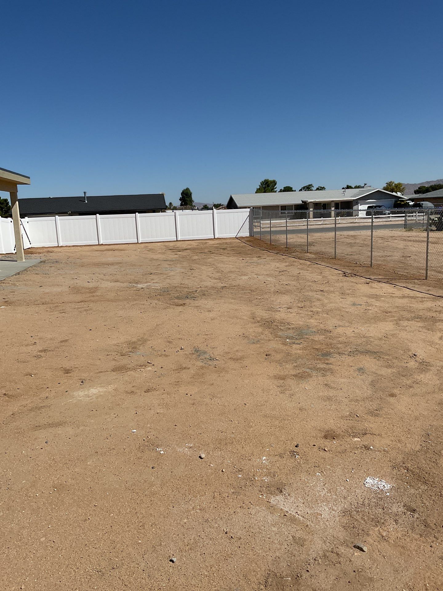 6ft White Privacy Vinyl Fence with Chain-link Fence by Fence Guys Inc.