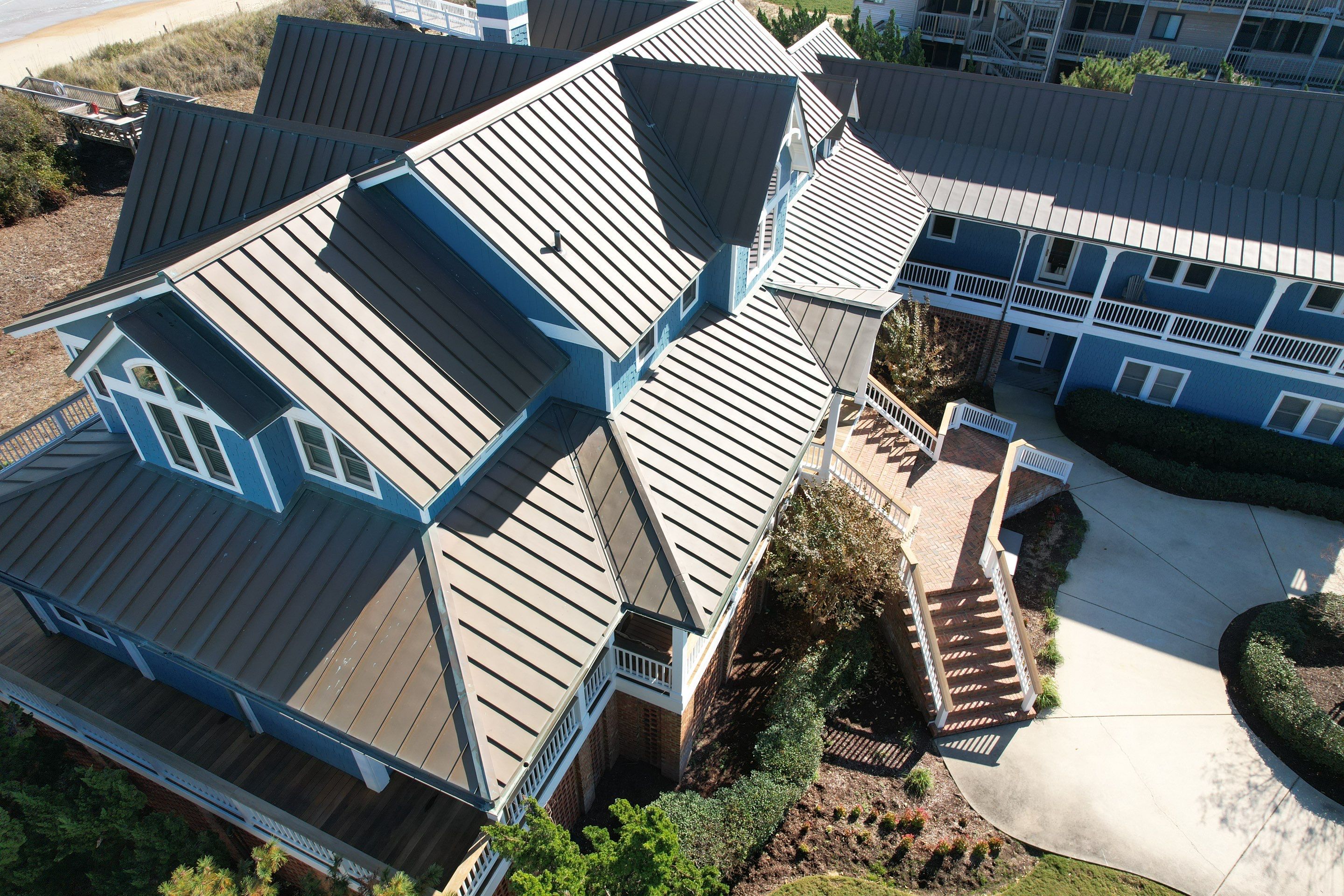 Large Metal Roof Transformation by Gallop Roofing & Remodeling, Inc.