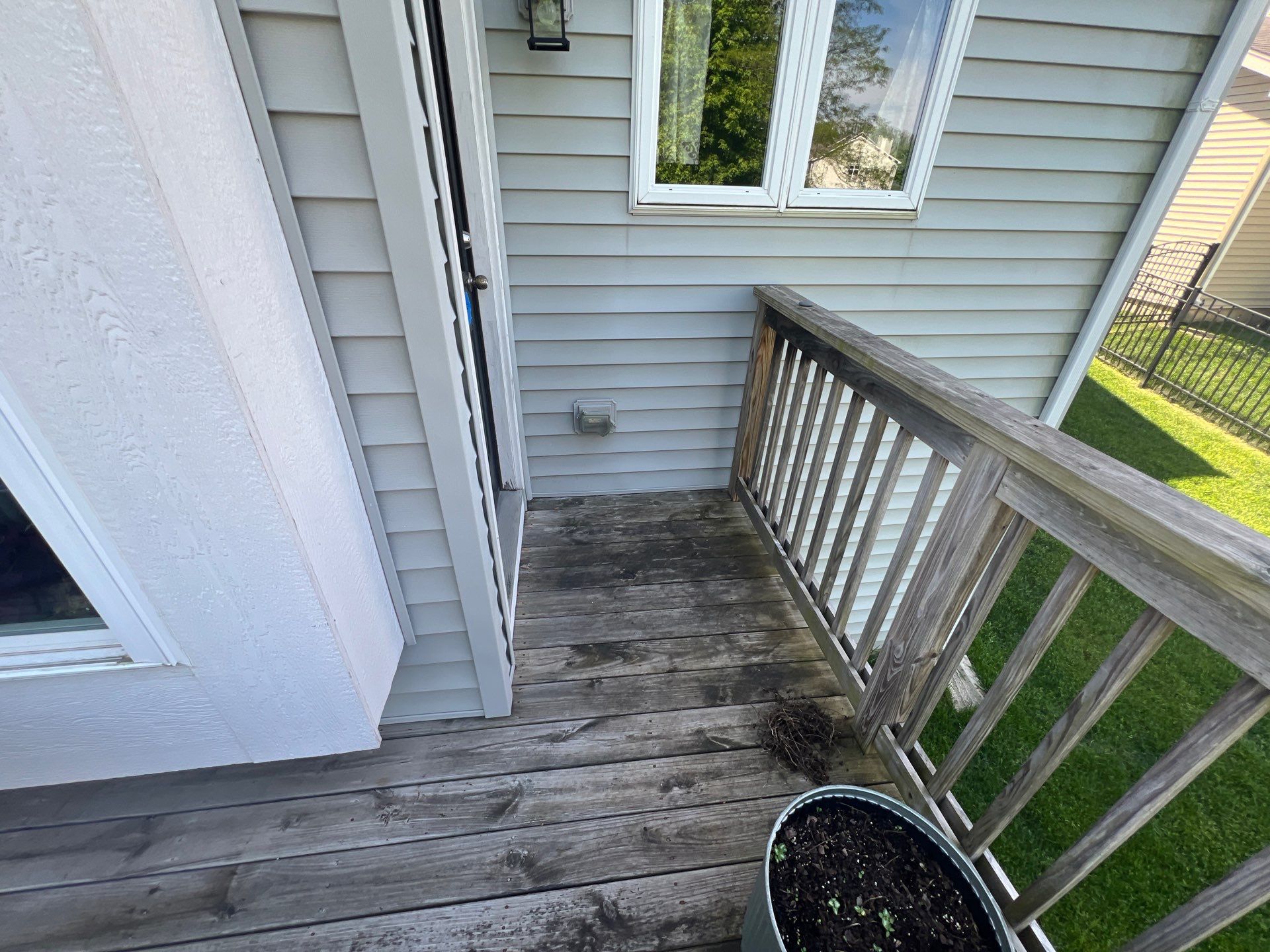 wood deck cleaning and staining by Northern Power Washing LLC.
