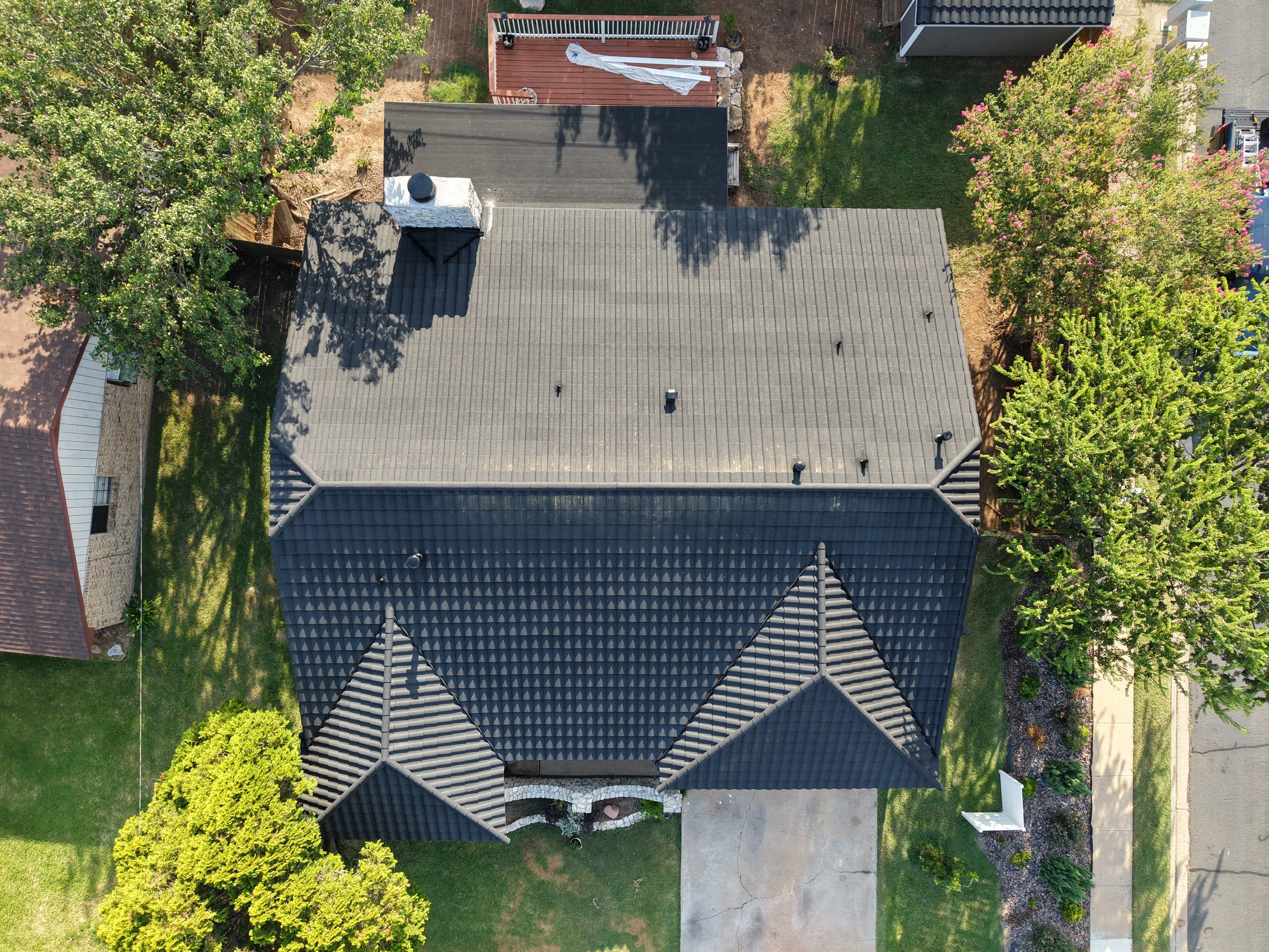 Residential Roof Replacement using Decra Villa Tile by Action Exteriors Austin