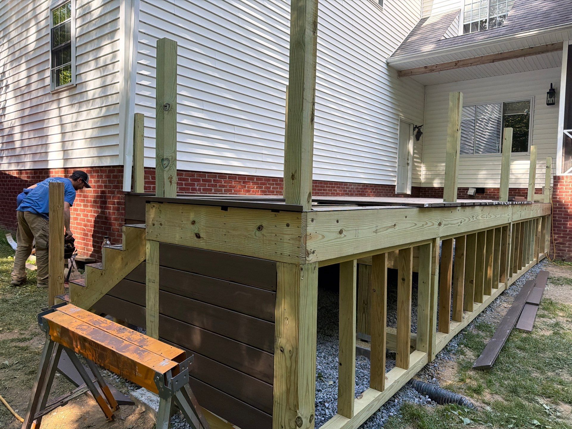 Custom Composite Deck and White Vinyl Railing Installation in Fayetteville by Walnut Hollow Decks & Outdoor Living