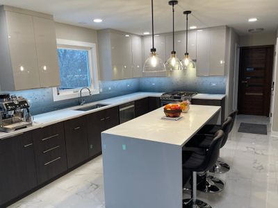 Let It Rain Kitchen Remodel using IMAGIO Solid Glass Backsplash