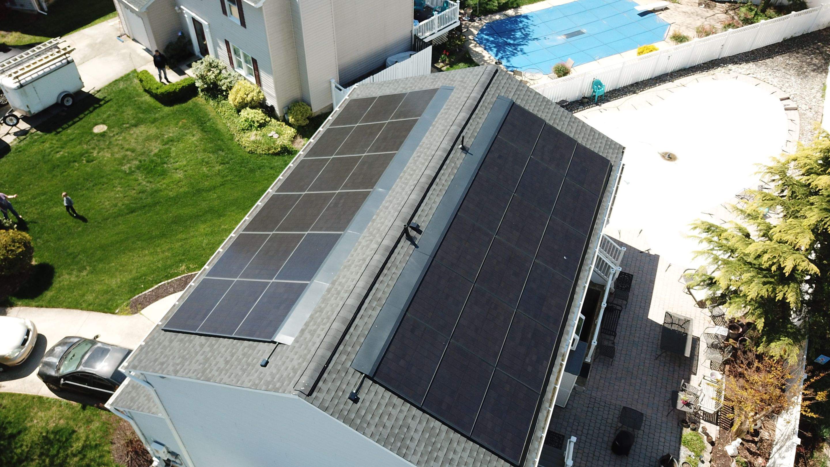 Roof Replacement with GAF Decotech integrated solar panels by American Home Contractors