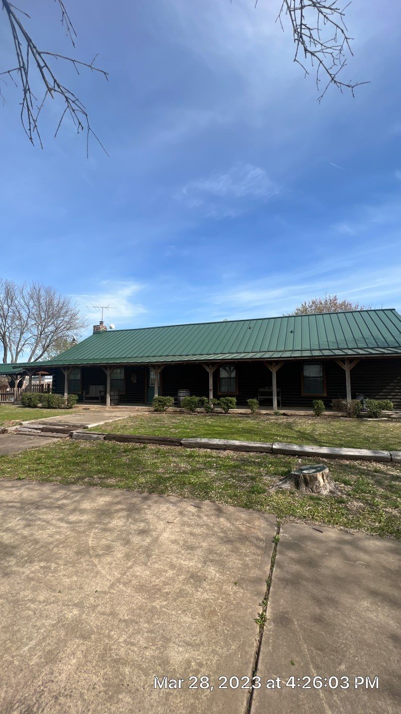 Shingle to Standing Seam Metal Roof by Springtree Restoration