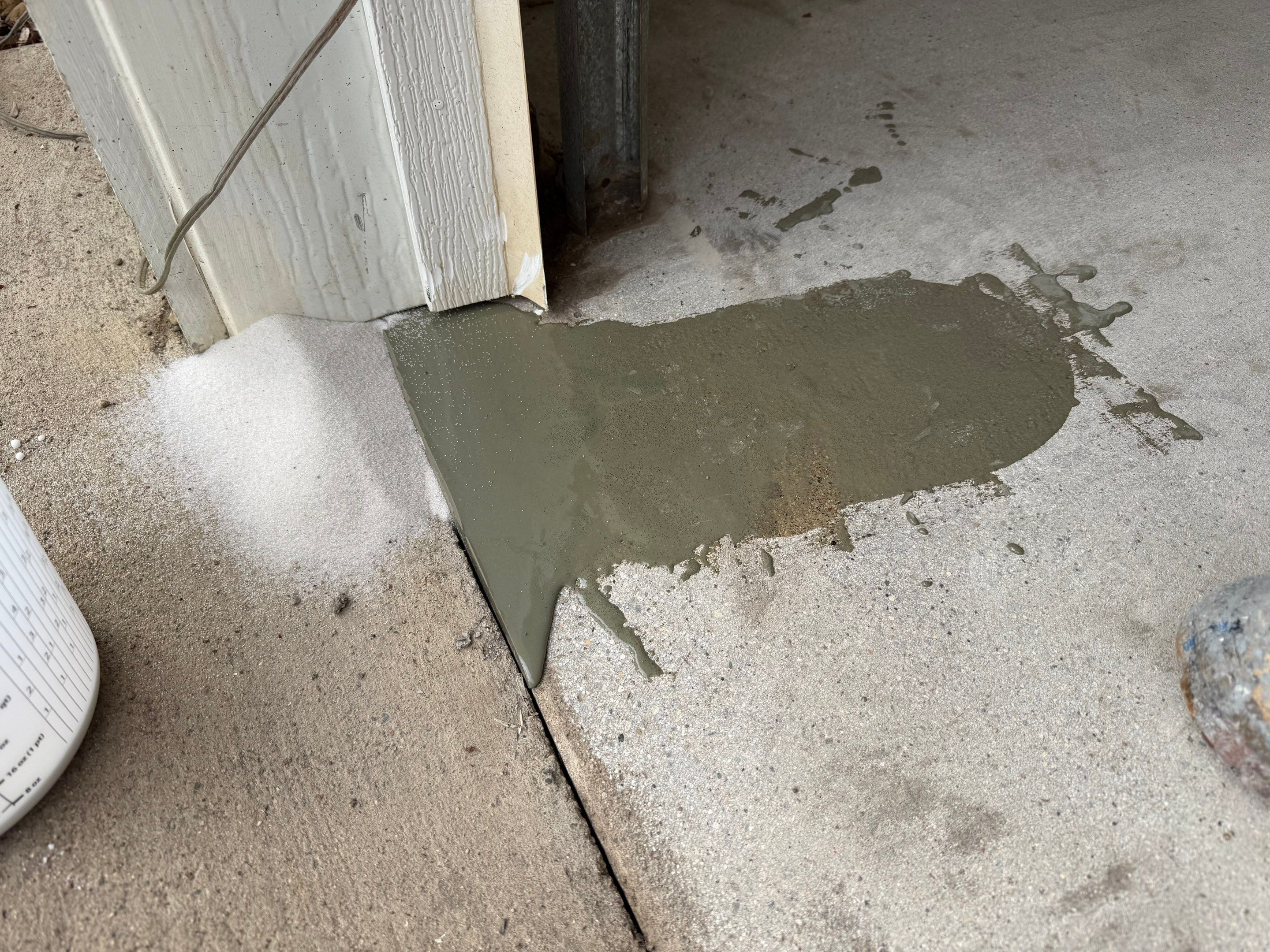 Feather Grey Garage Floor Coating and Crack Repair in Beresford by Select Painting, Coatings & Garage Cabinets