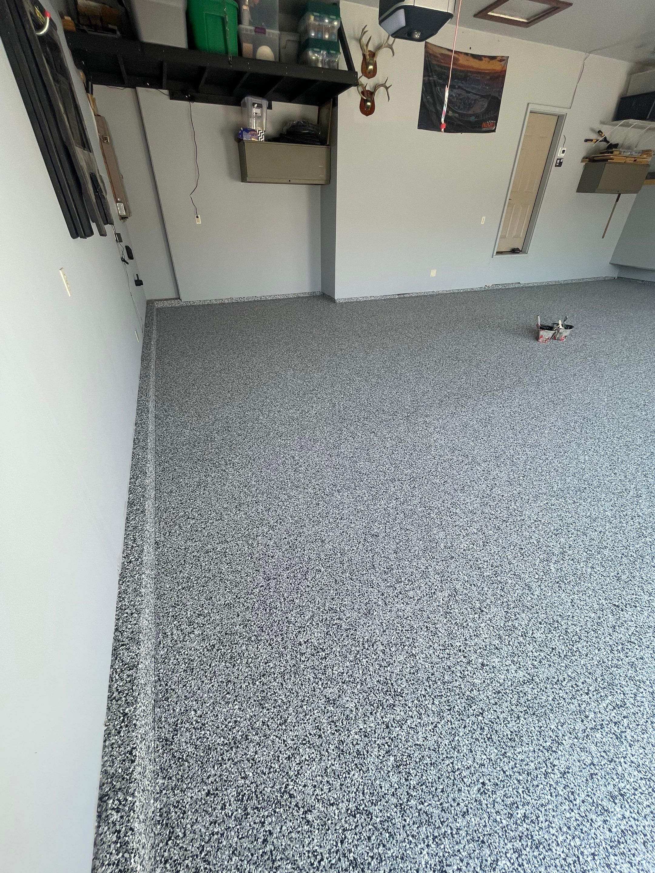 Sioux Falls Garage Concrete Coating Installation with Domino Flake by Select Painting, Coatings & Garage Cabinets
