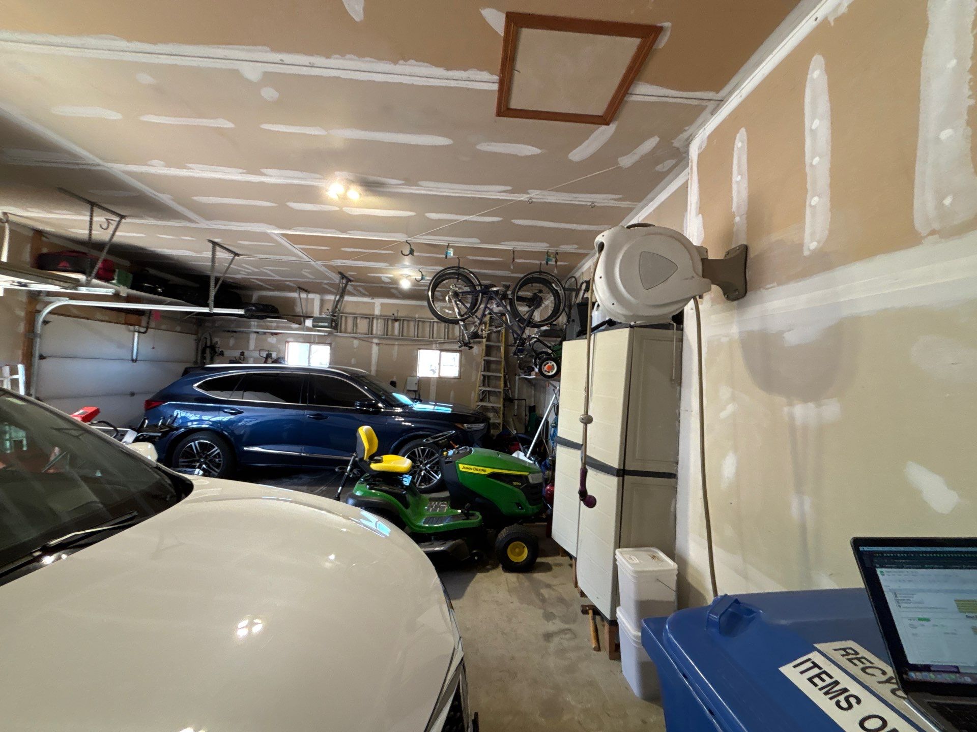 Sioux Falls Garage Concrete Repair and Epoxy Flake Floor Coating by Select Painting, Coatings & Garage Cabinets