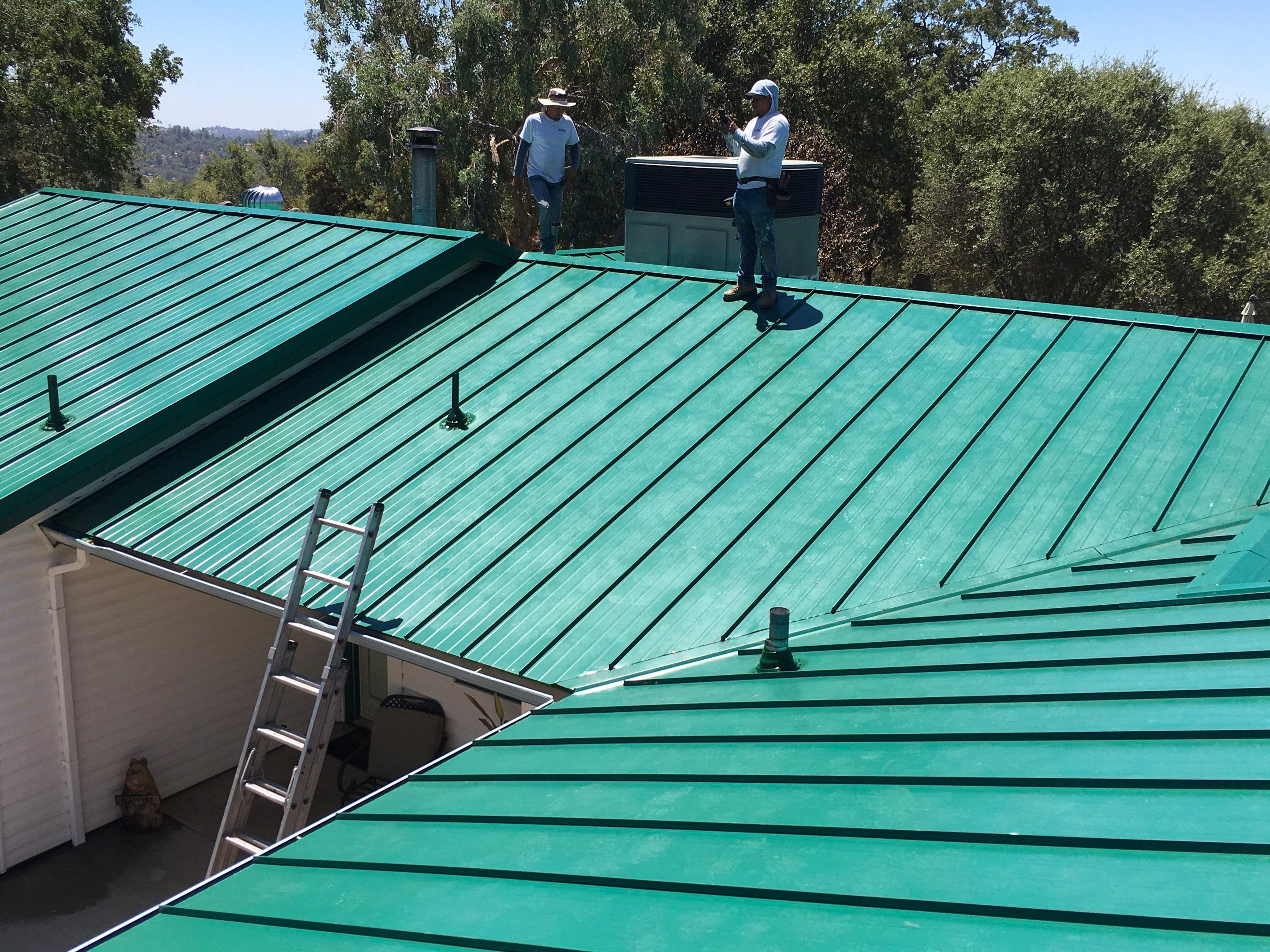 Metal roofing installation using Standing seam metal roofing system by Straight Edge Roofing Inc