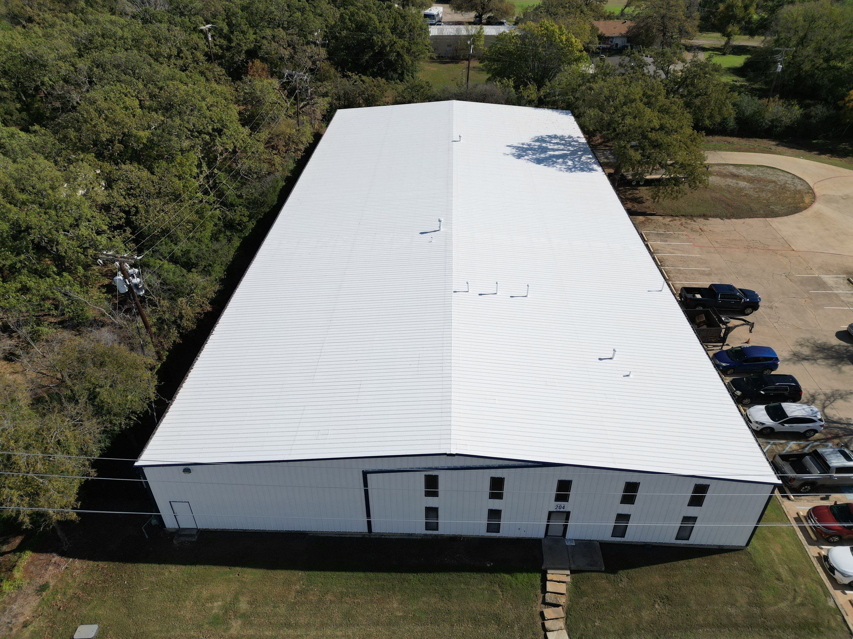 Silicone Coating Metal Rehab by First Out Roofing 