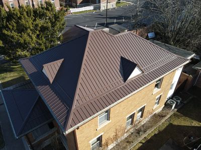 Residential Roofing Installation using Performance Panel Metal - Brown