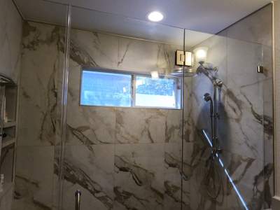 Master Bathroom Renovation Featuring Marble-Look Tile and Quartz Countertops