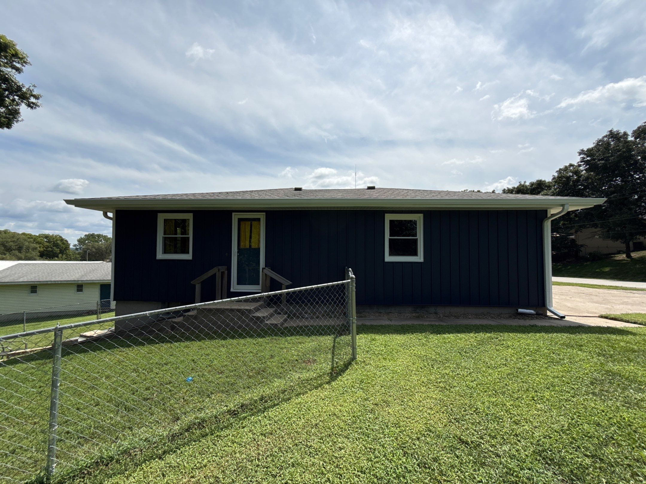 Indigo Board and Batten Siding and Window Replacement in Smithville by EEC Windows, Siding & Roofing
