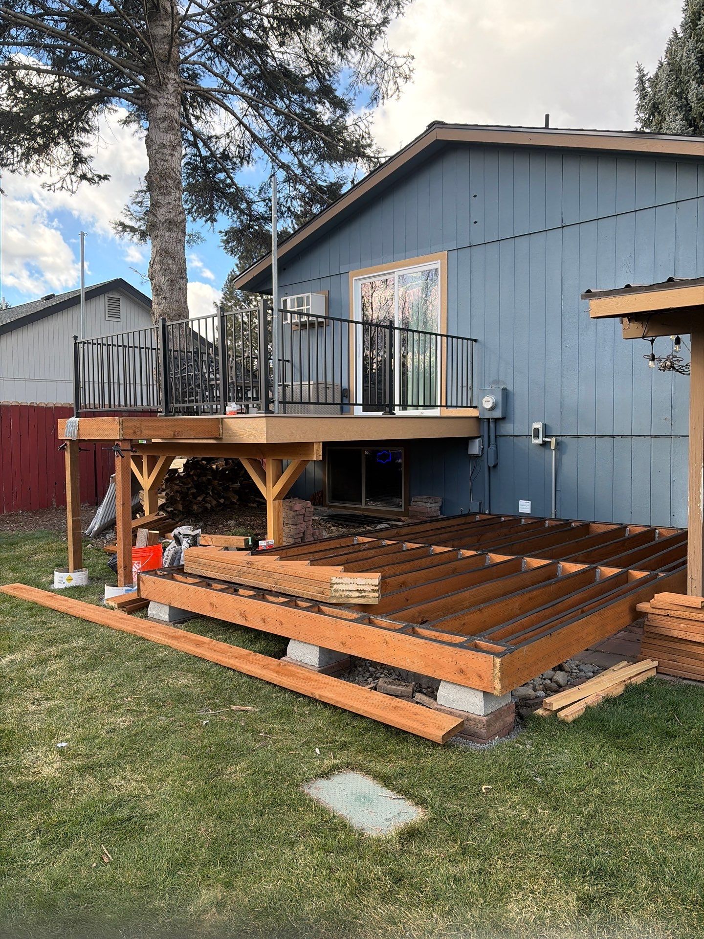 Add a platform deck below an existing elevated deck that was there prior by Home Helpers General Contracting