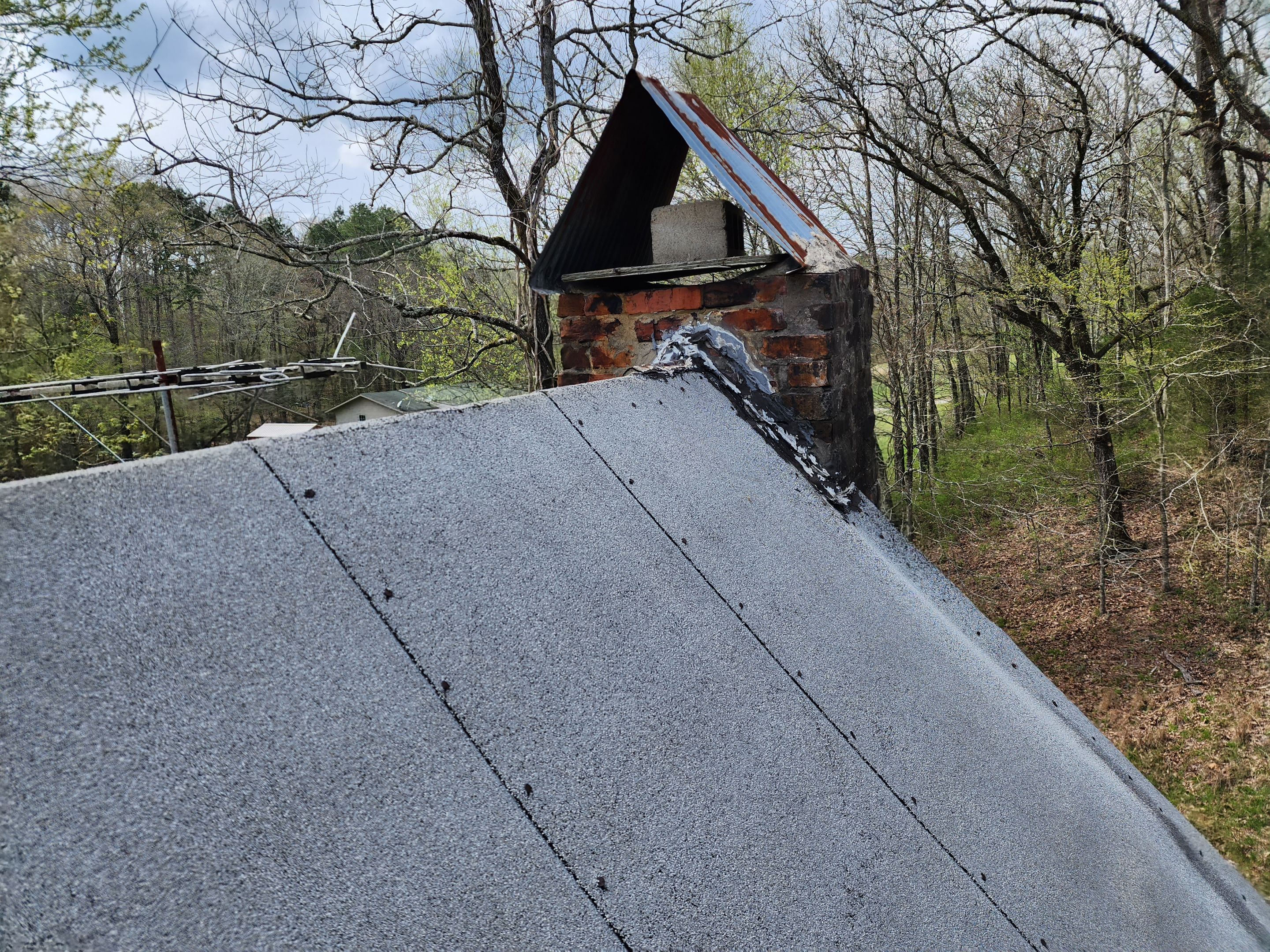 Residential Roofing Installation using 26 Gauge Colored Panels by Hostetler Roofing