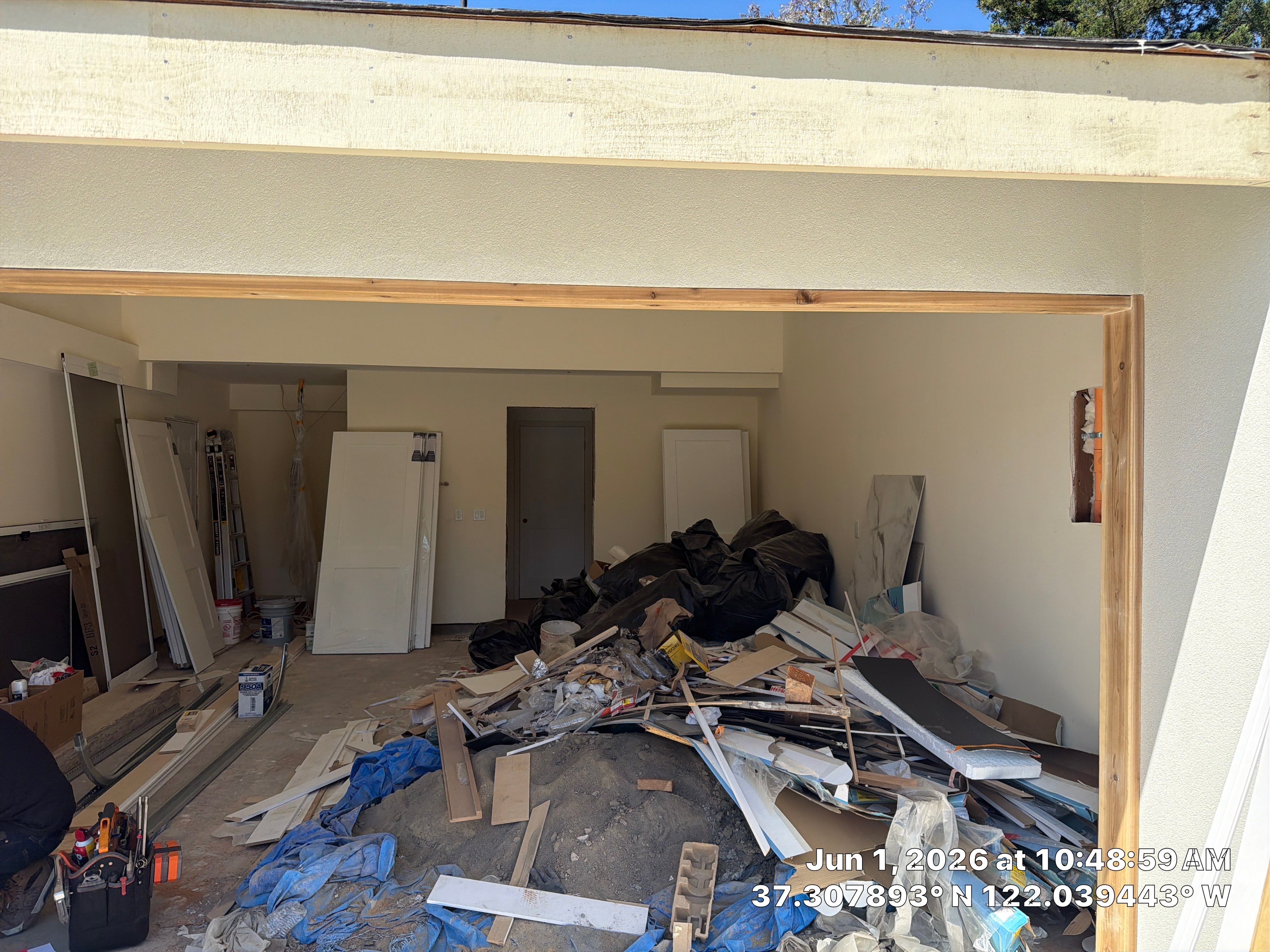 Modern Black Garage Door Installation With Vertical Windows In Cupertino by Valiant Garage Door LLC