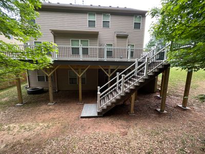 Custom Elevated Deck Replacement with White and Black Railings