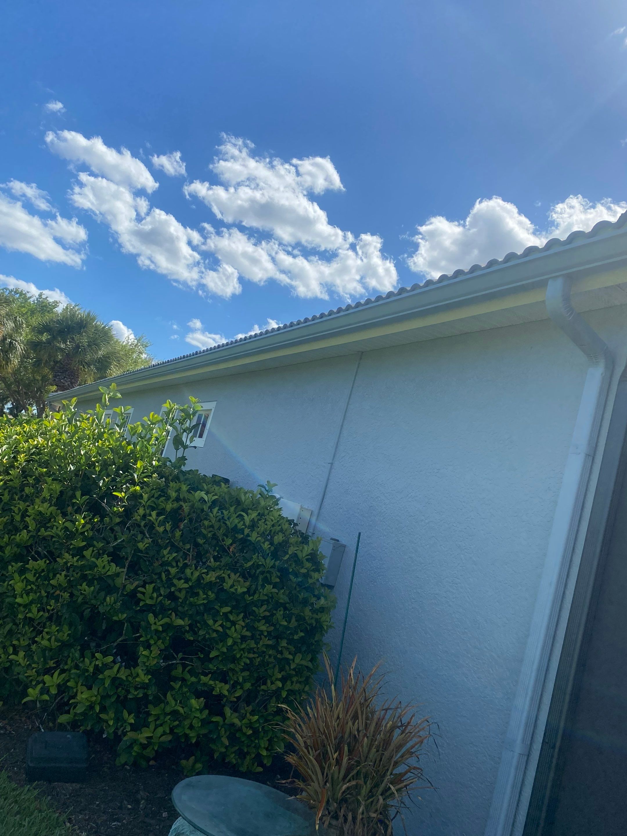 6-inch K-style Seamless Gutters and Splash Guard in Grey Color in Naples FL by Gutter Professors