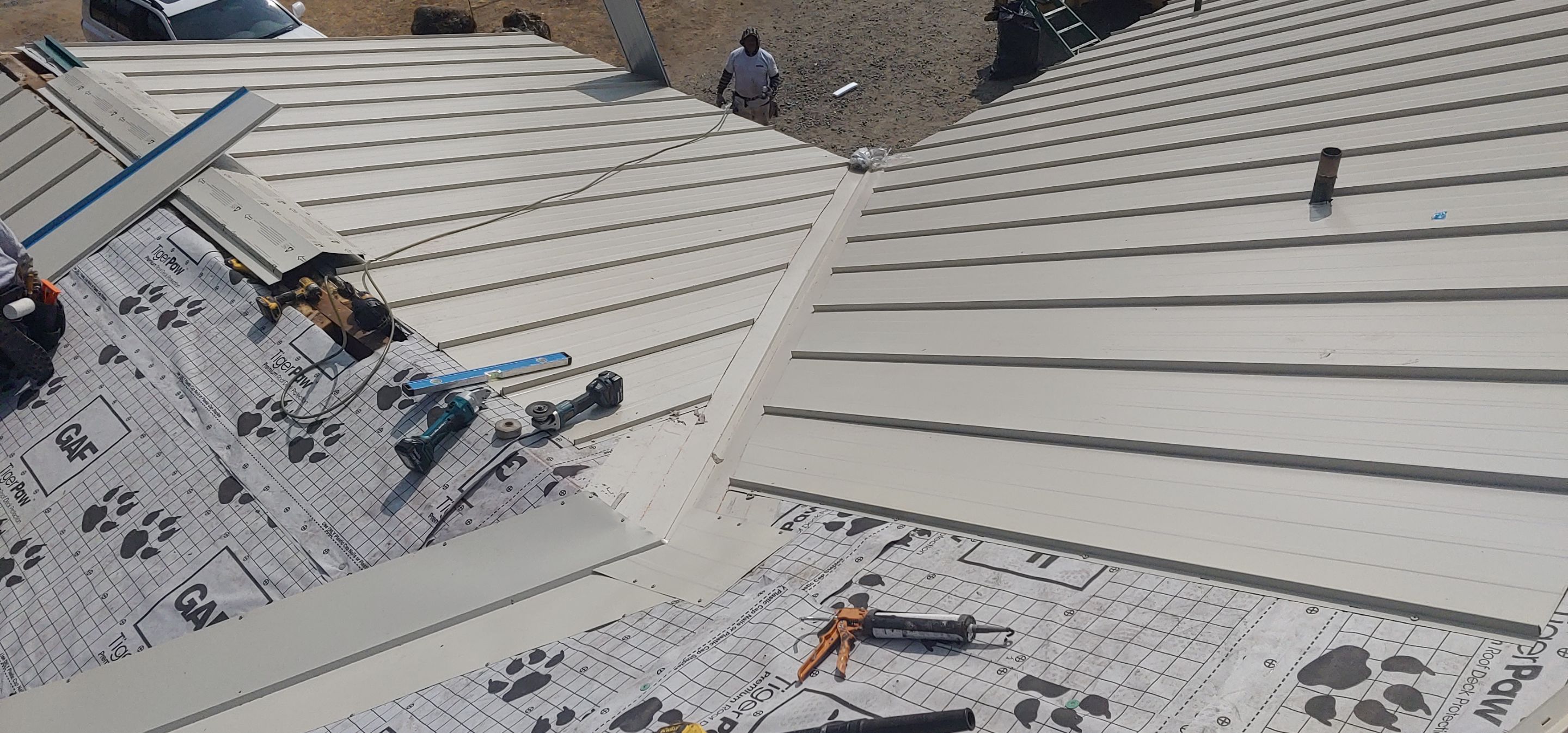 Residential Roofing Installation using Standing seam metal roofing system by Straight Edge Roofing Inc