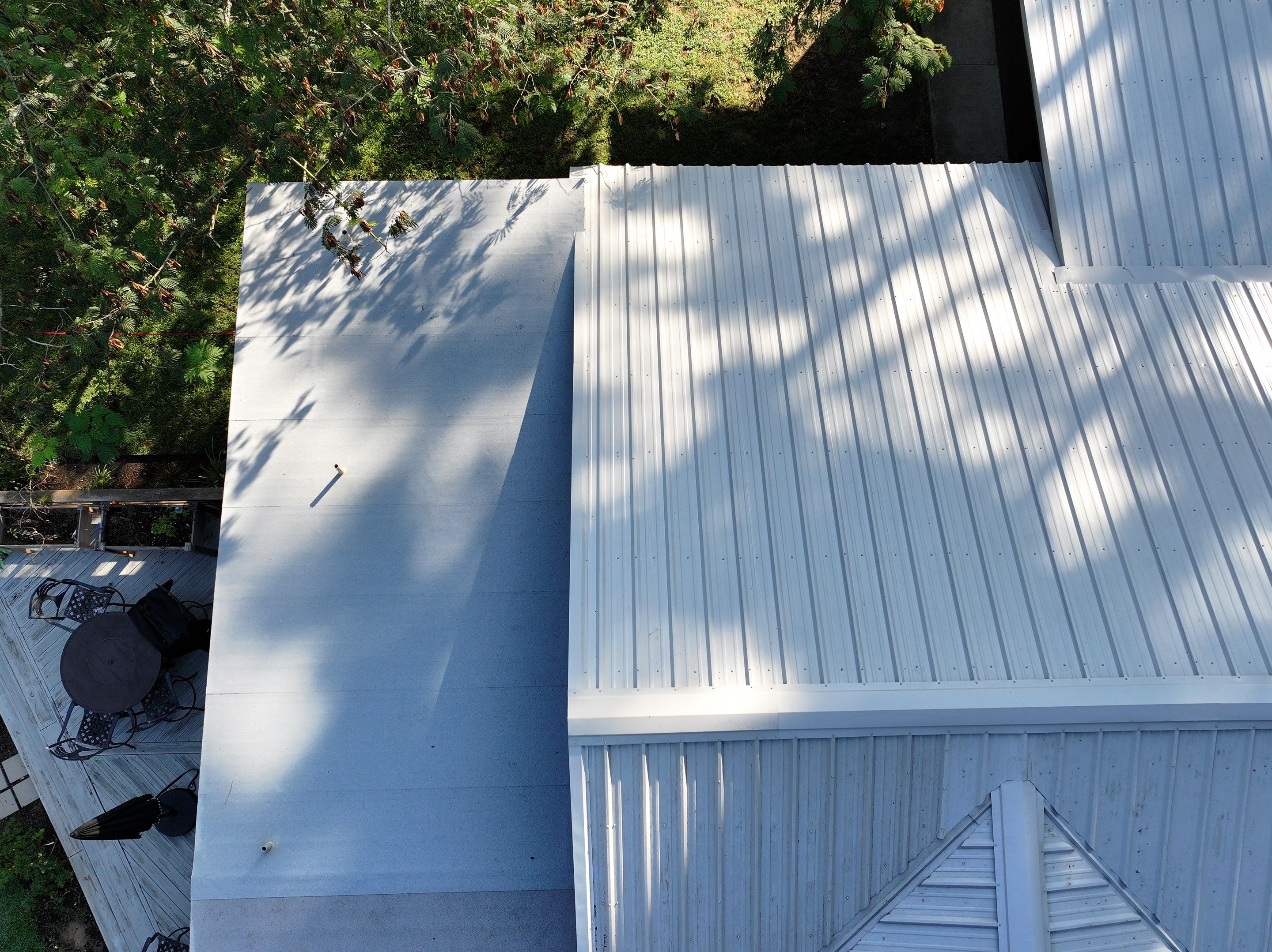 White Standing Seam Metal Roof Replacement in Willis, Texas by Abbott Roofing Company