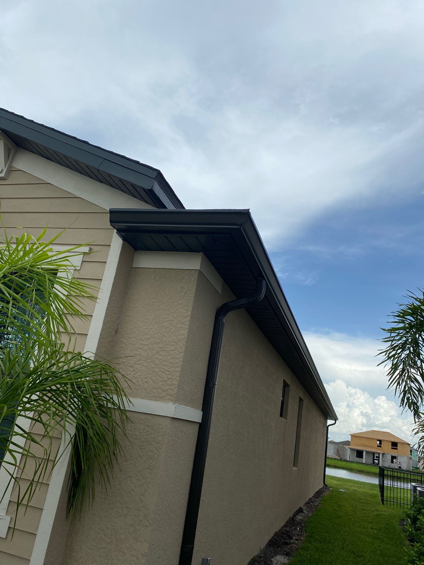 Brown Seamless Gutters for Homes in Fort Myers by Gutter Professors