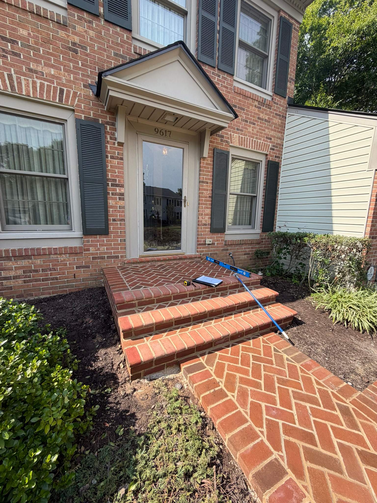 Custom Exterior Handrail Installation on Brick Entryway in Fairfax Station by Capitol Iron Works