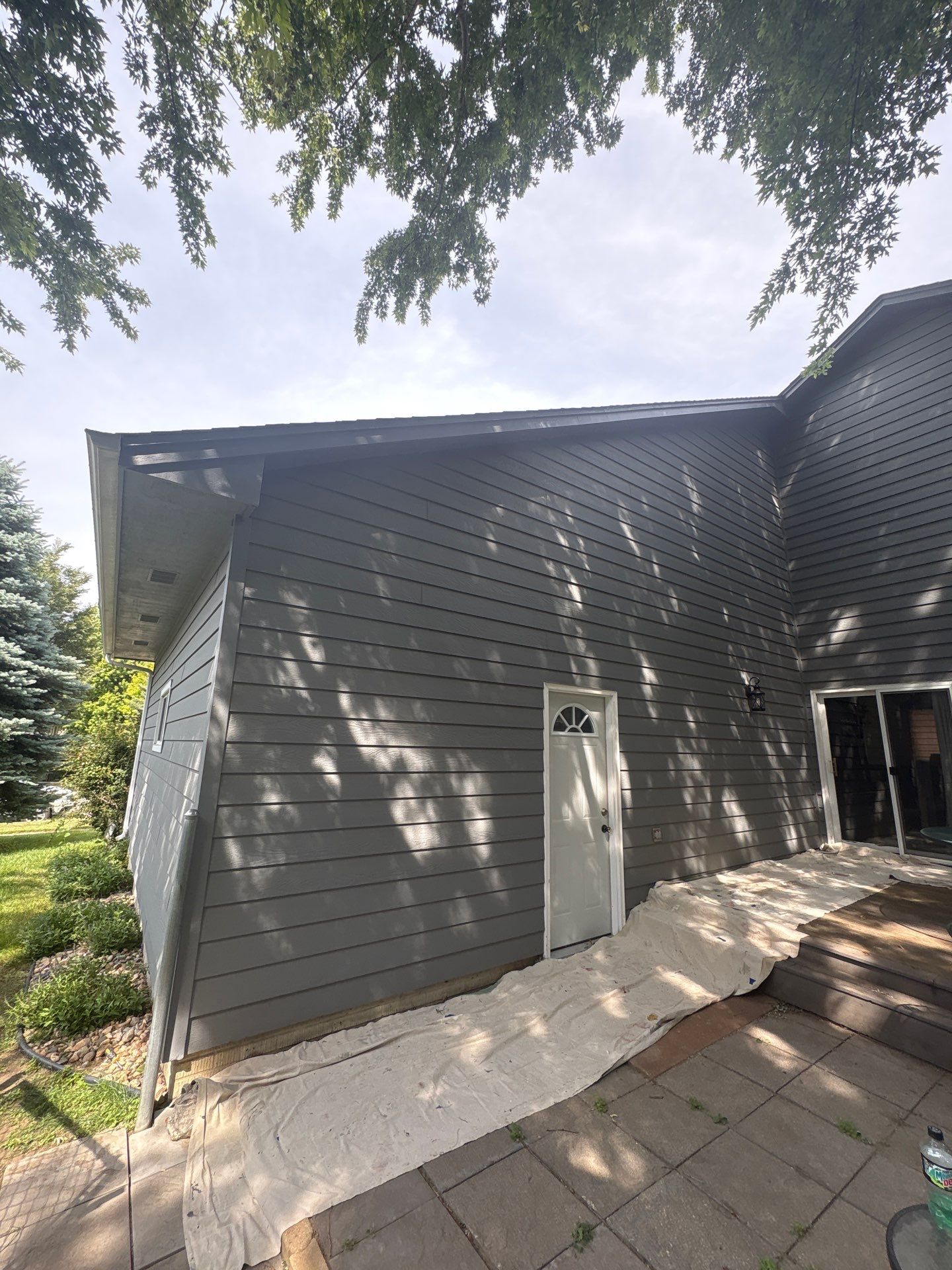 Full Exterior Painting for Gray Siding and Trim in Sioux Falls by Select Painting, Coatings & Garage Cabinets