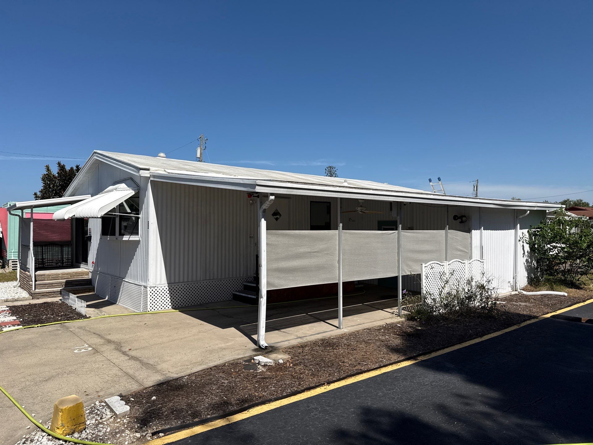 Mobile Home Soft Wash & TPO Roof Cleaning in Plaza Estates – Bradenton, FL by Sunshine AquaWash