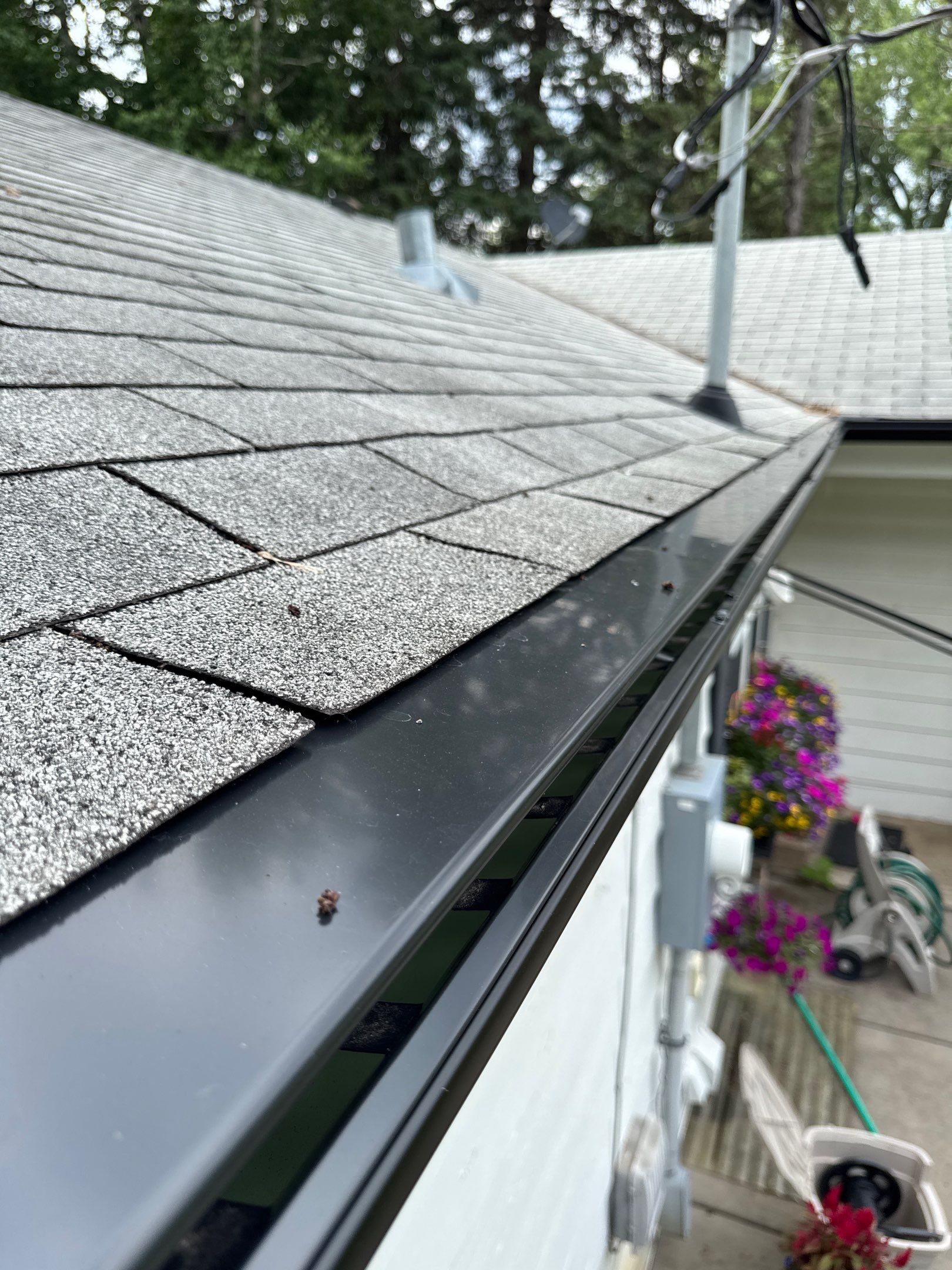 Eagan - Black Seamless Gutters with Helmet Style Guards by Forever Fortified