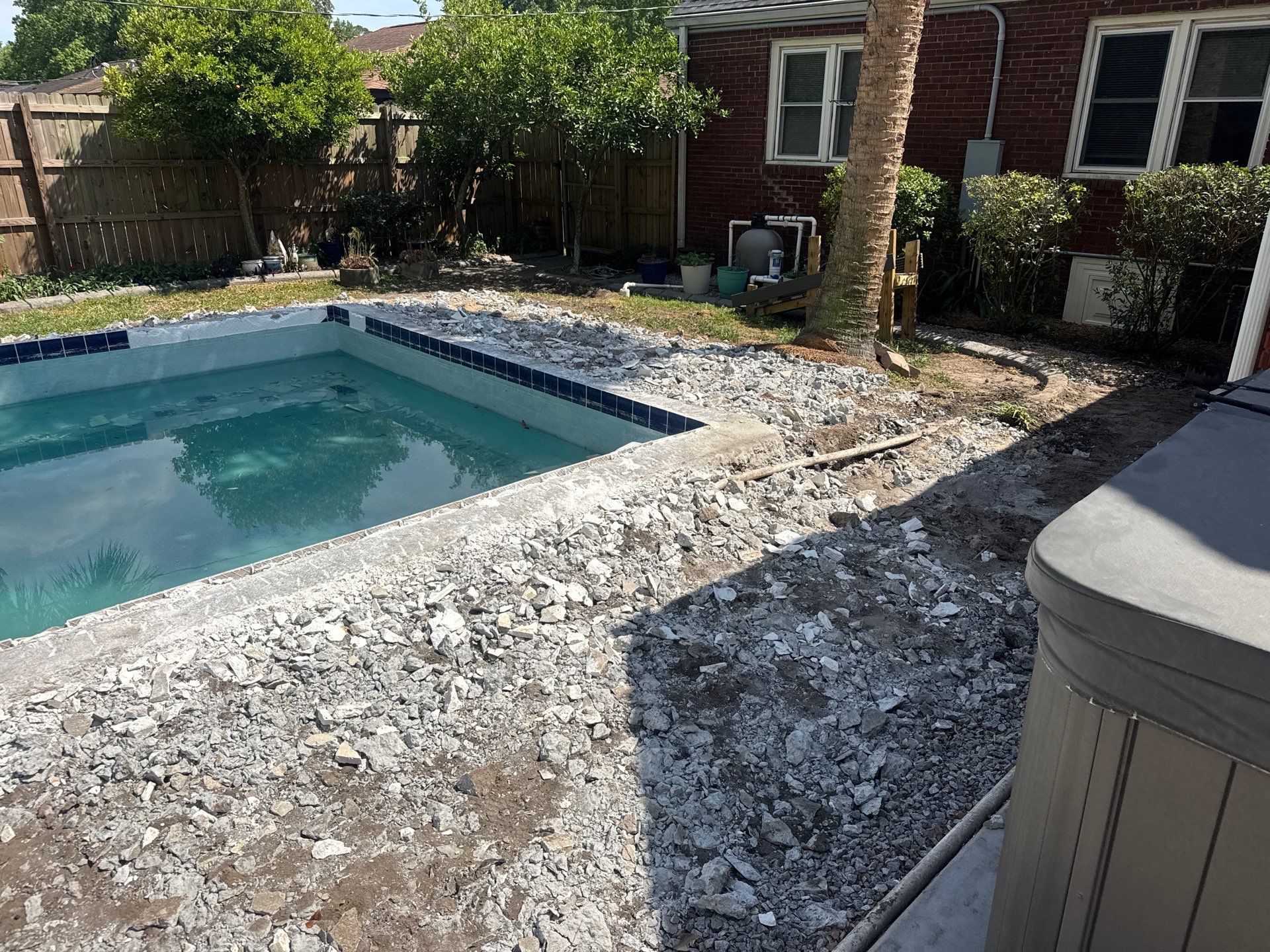 Savannah Pool Deck Replacement with Textured Concrete and Brick Coping by Lowcountry Scapes, LLC