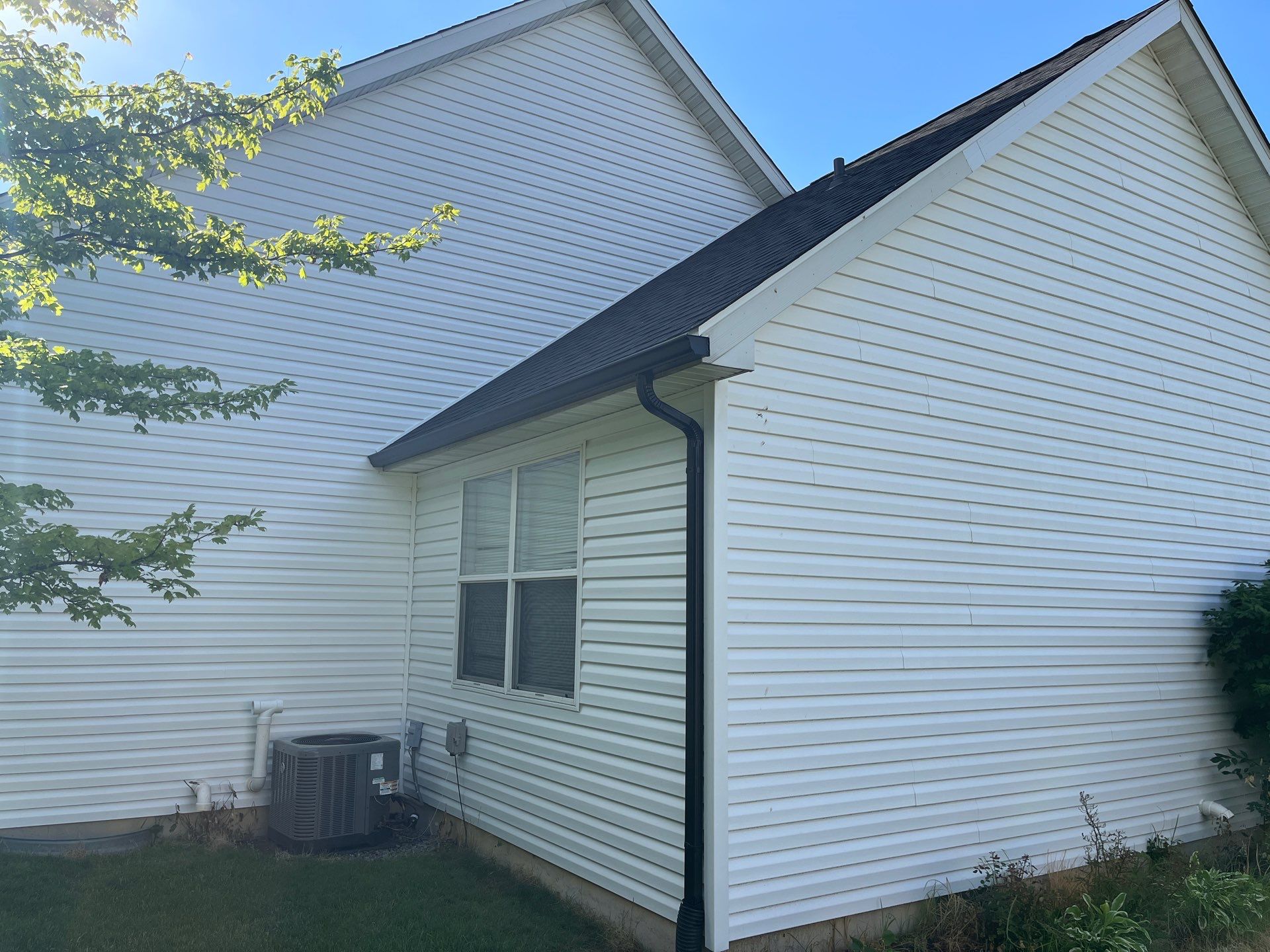 Exterior Installation using Onyx Black Durations and White Siding by WIW Enterprises Inc