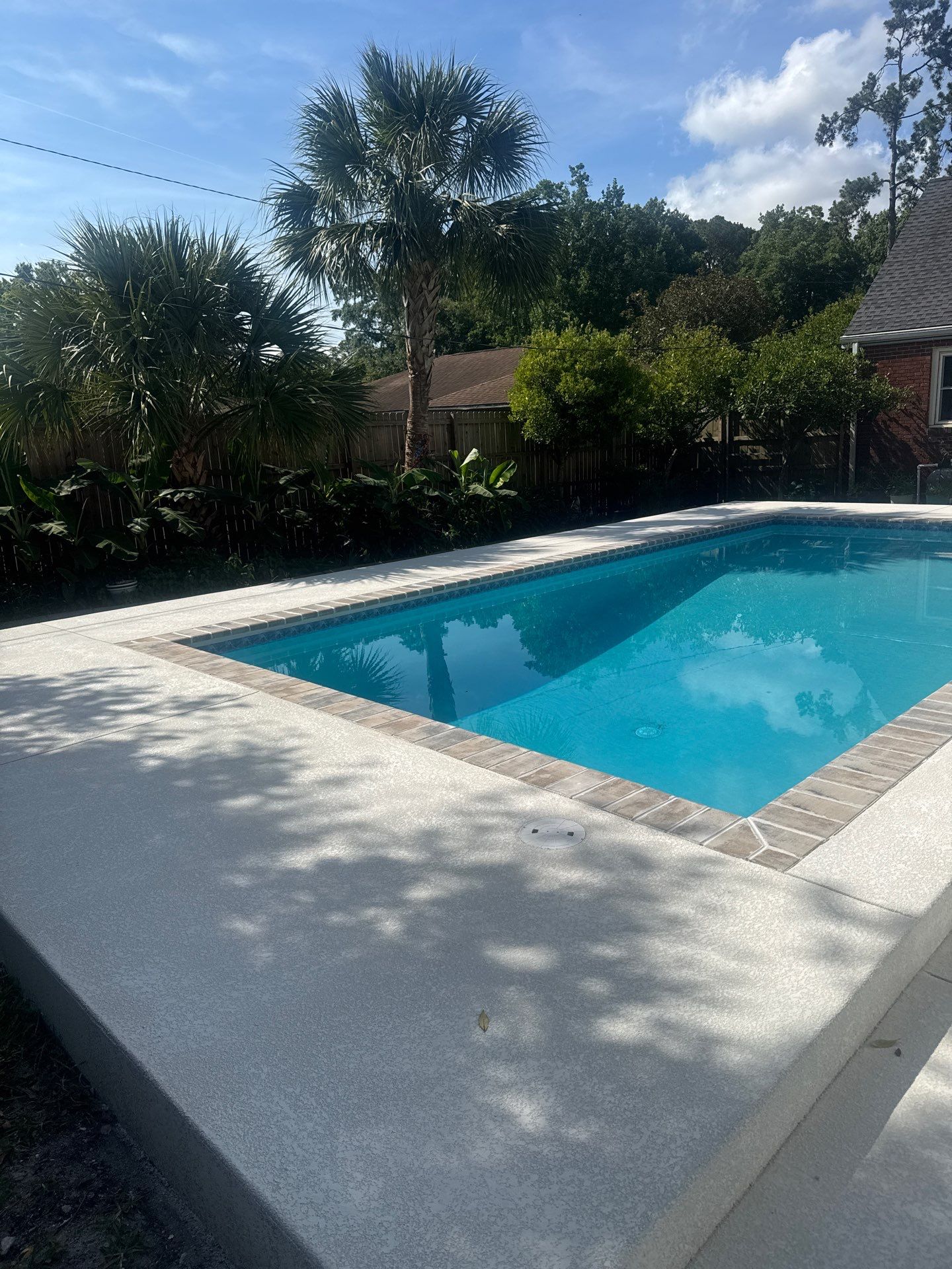Savannah Pool Deck Replacement with Textured Concrete and Brick Coping by Lowcountry Scapes, LLC