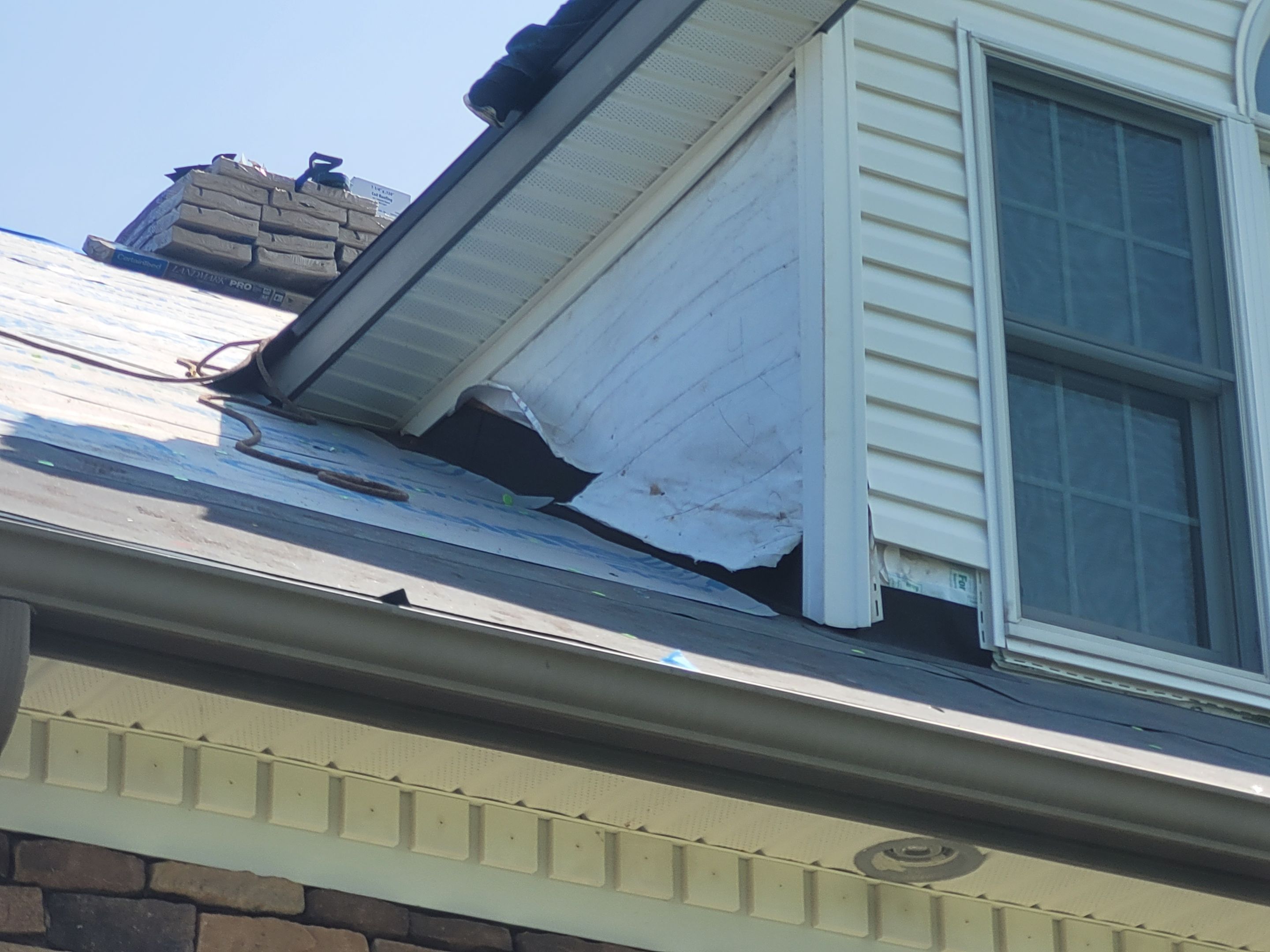 Roof Damage using Certainteed Lifetime Roofing System- Moire Black Landmark Pro shingkes with shadow ridge caps. by BulletpROOF Exteriors