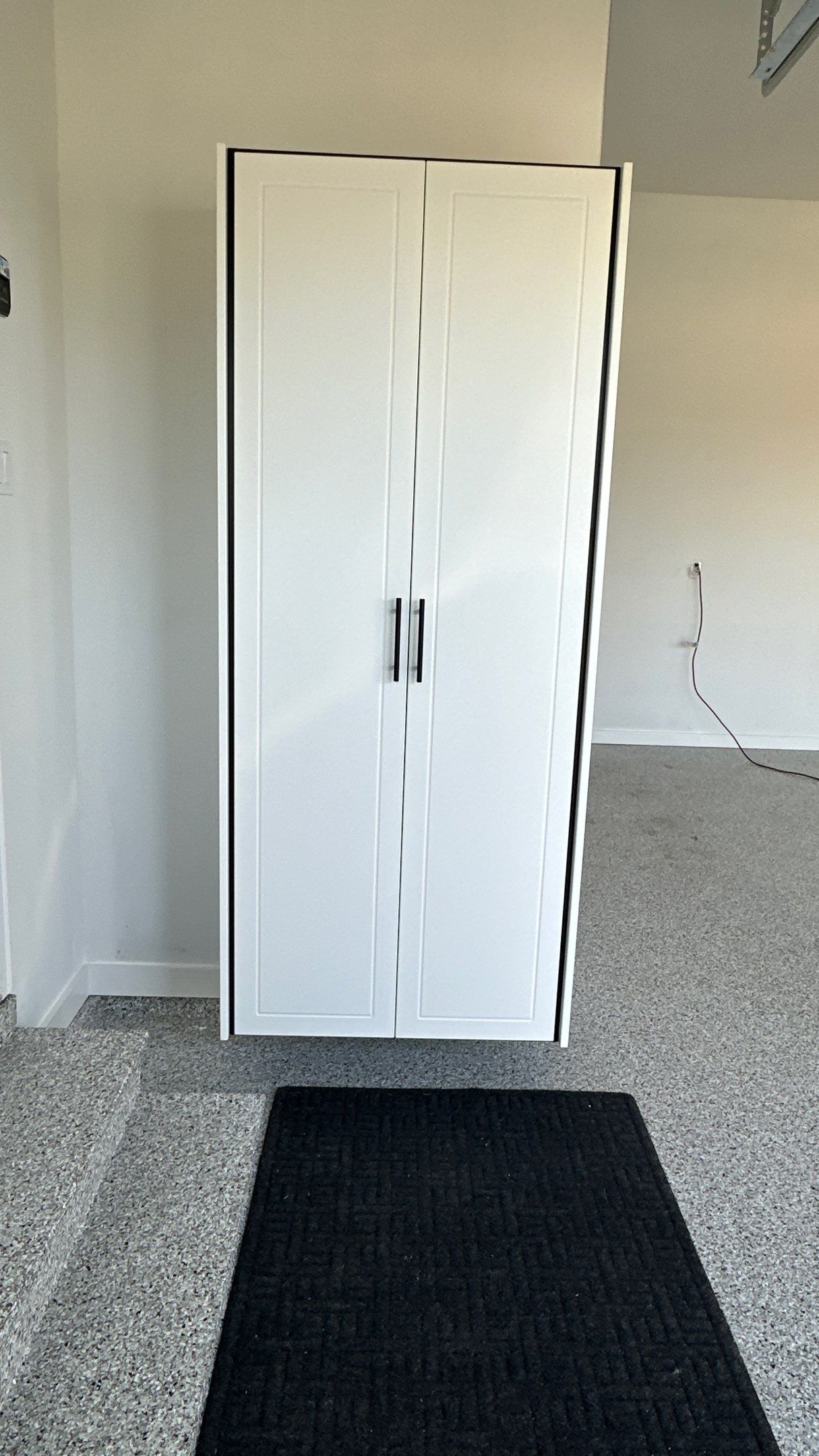 Jon S. transformed his garage with a new floor, slotwall & Cabinets! by Banner Garage