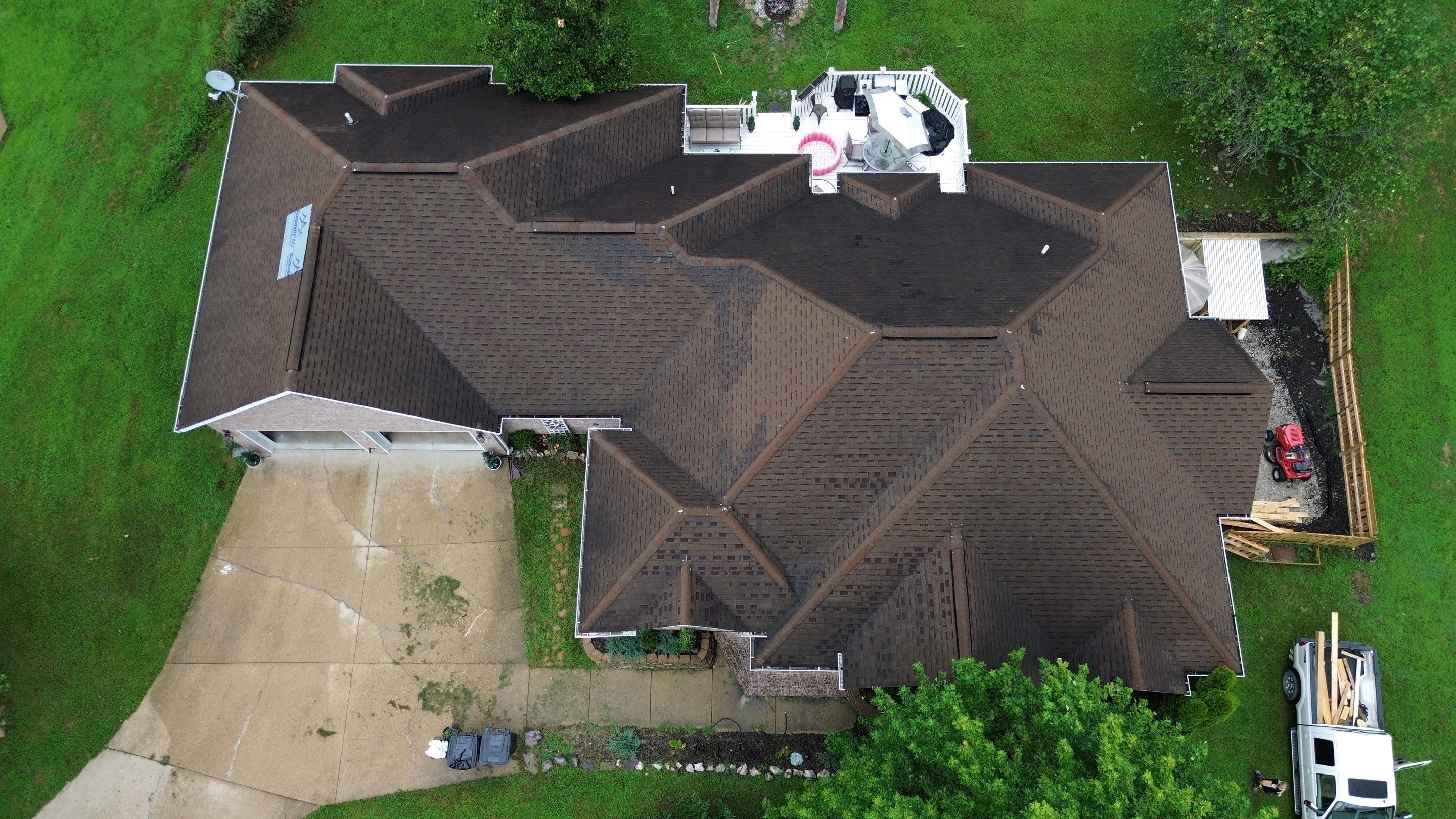 Residential Roofing Install - Green Atlas Pinnacle Pristine Shingles - White Gutters & Downspouts  by Titan Commercial & Residential Roofing 
