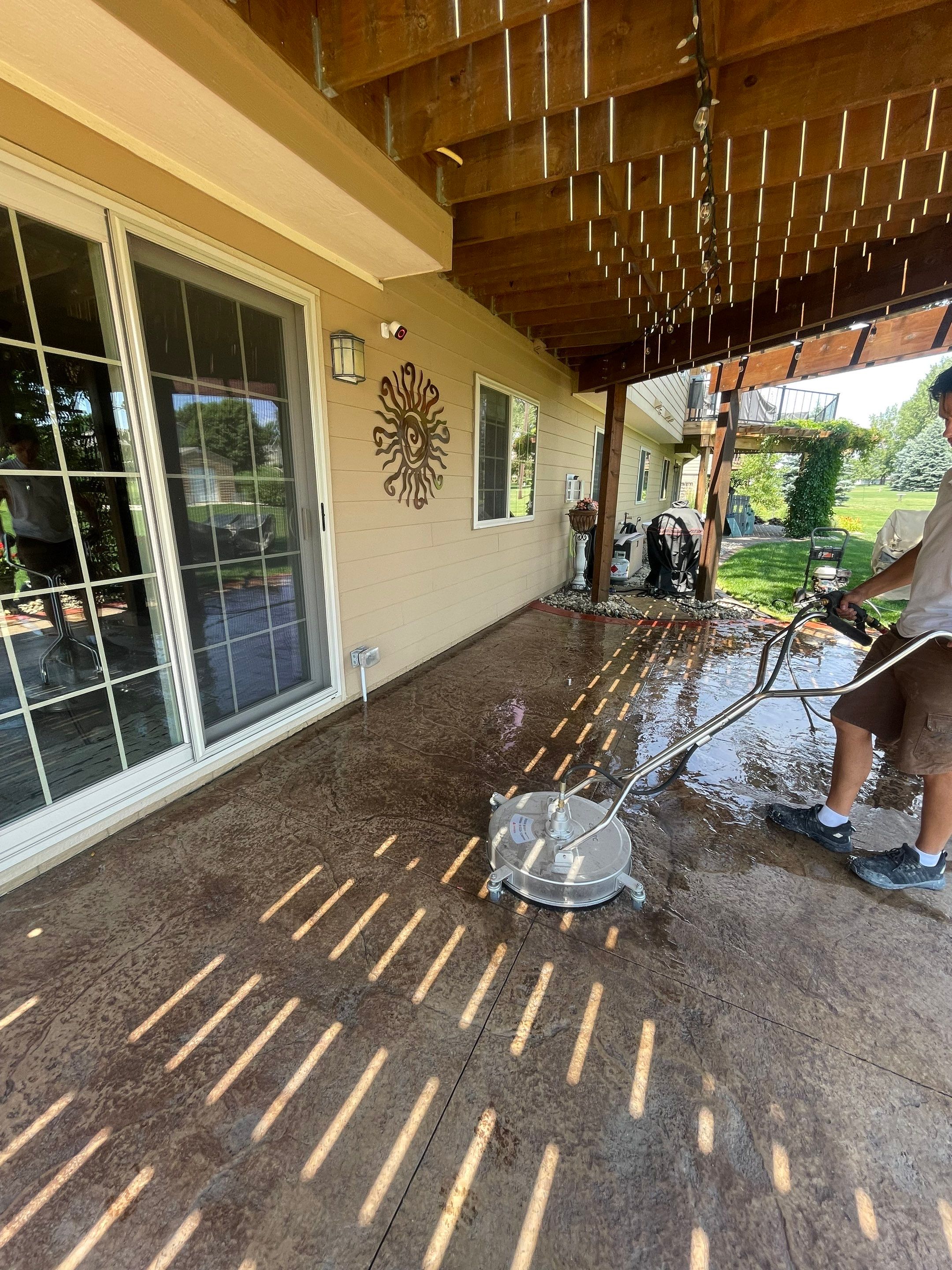 Custom Stamped Concrete Patio and Wood Pergola in Sioux Falls by Select Painting, Coatings & Garage Cabinets