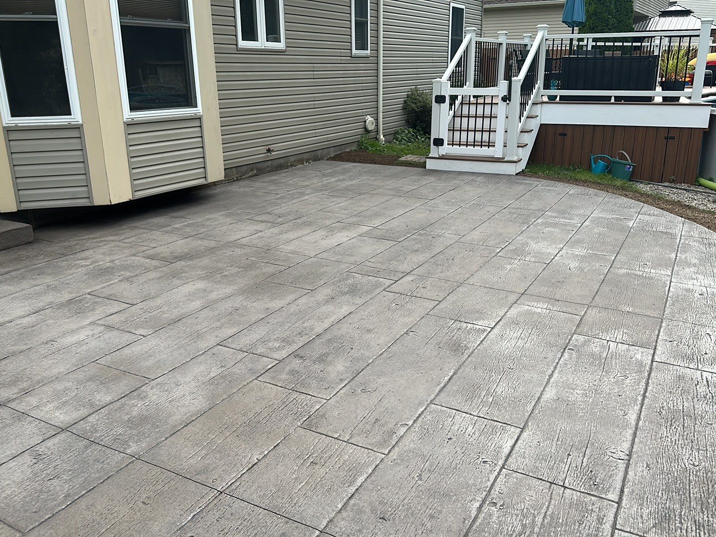 Wood Plank Stamped Concrete Patio  by NG Masonry & Construction LLC