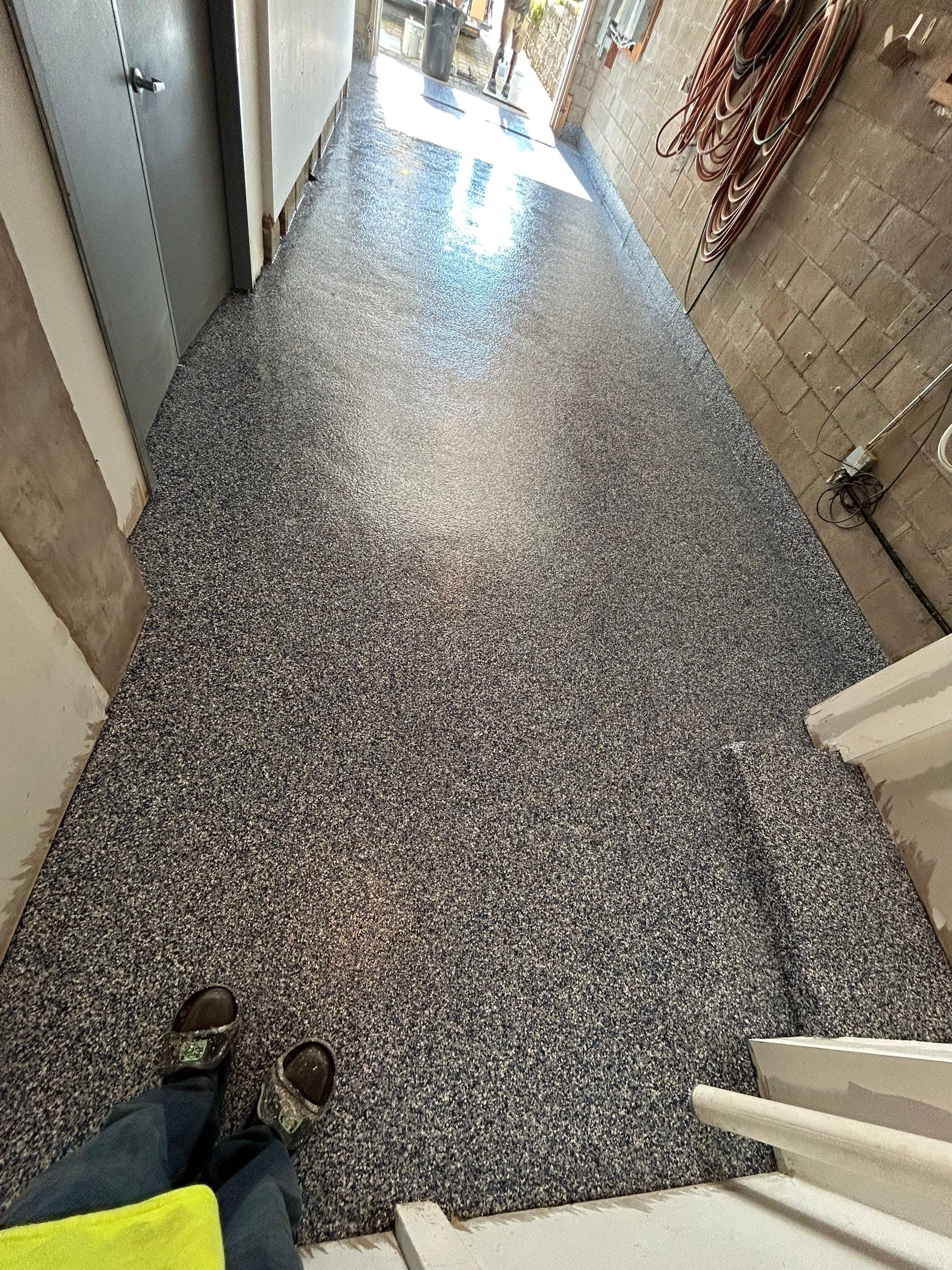 Garage Concrete Floor Coating Transformation by DiGiorgi Roofing and Siding Inc
