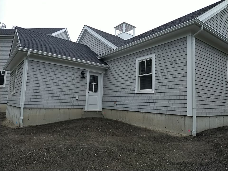 K-Style Gutter Installation with Round Downspouts in Marshfield, MA by Gutter Pro Enterprises