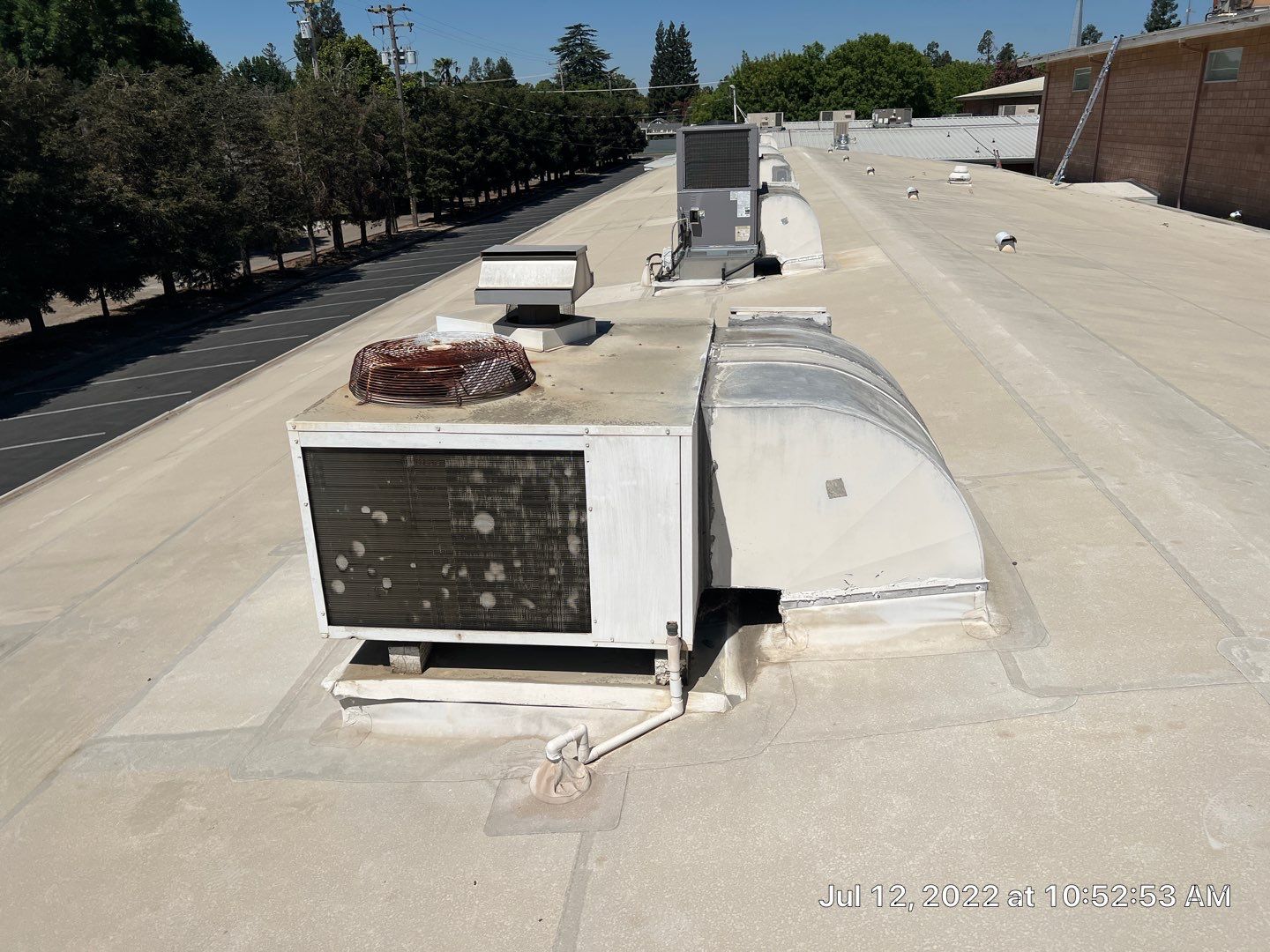 MR Roofing system using Benchmark/PUMA XL coatings over TPO single-ply roofing by Straight Edge Roofing Inc