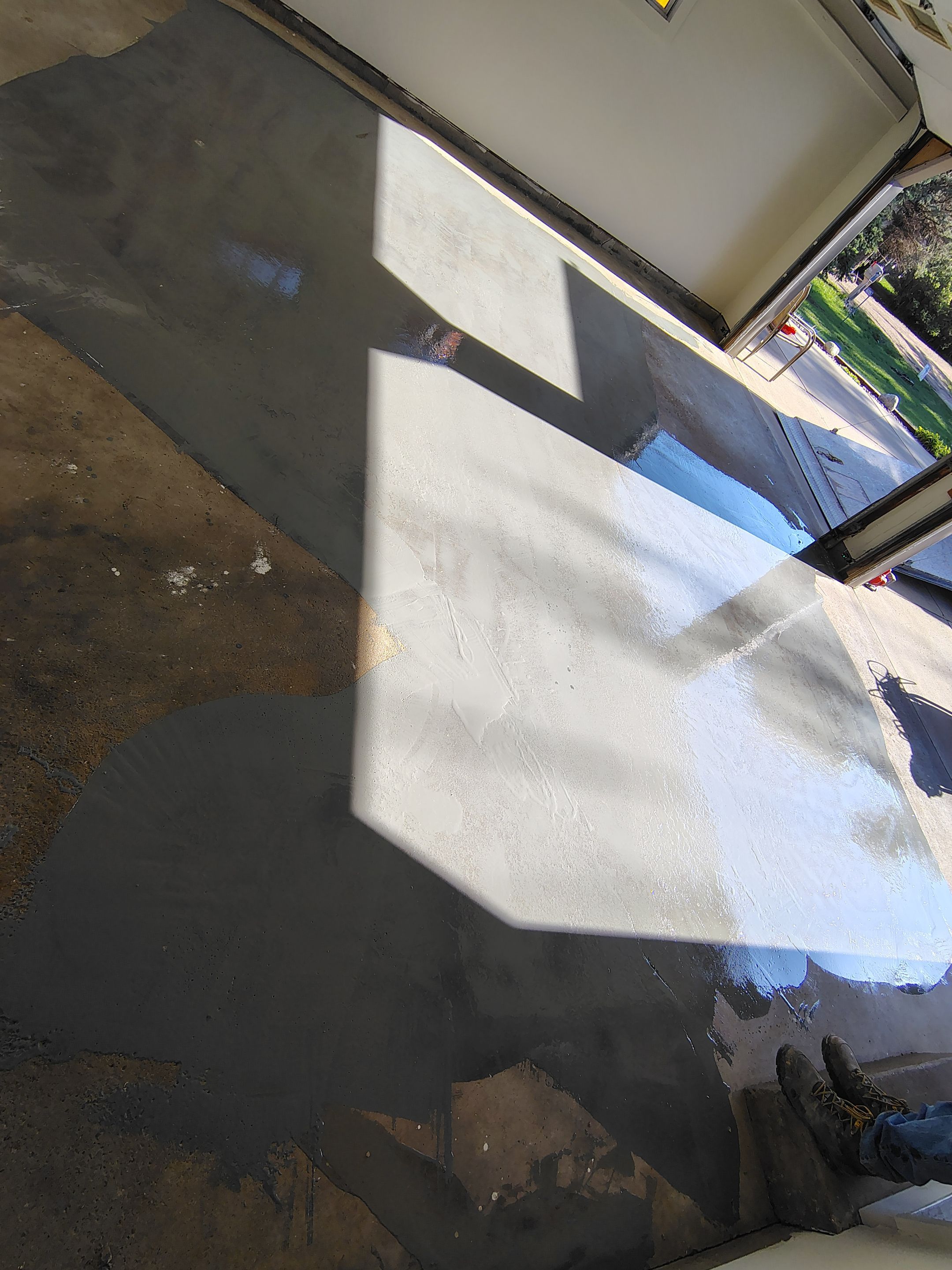 Full-Flake Epoxy Garage Floor Coating Installation in Sioux Falls by Select Painting, Coatings & Garage Cabinets